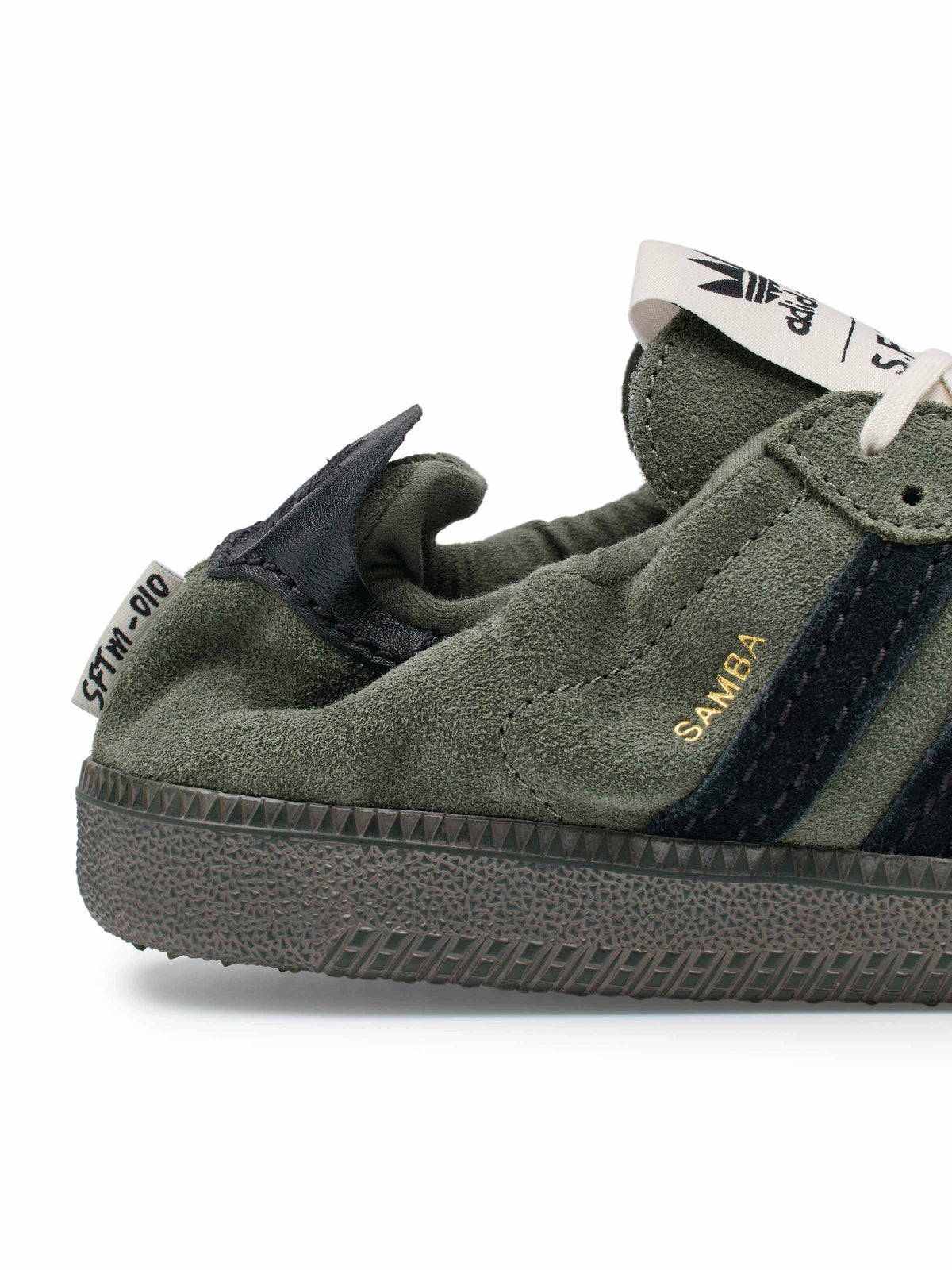 adidas x Song for the Mute ADI008 Samba OG SFTM sneaker, close-up side view with suede texture and gold-tone branding.
