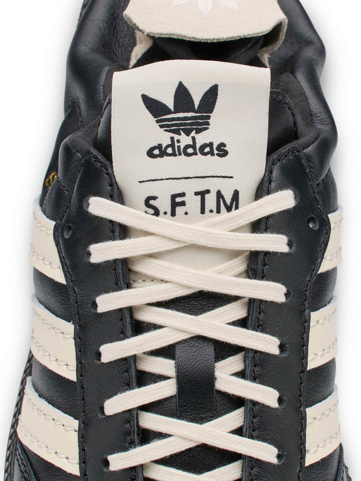 adidas x Song for the Mute ADI008 Samba OG SFTM sneaker, close-up of co-branded tongue label and laces.