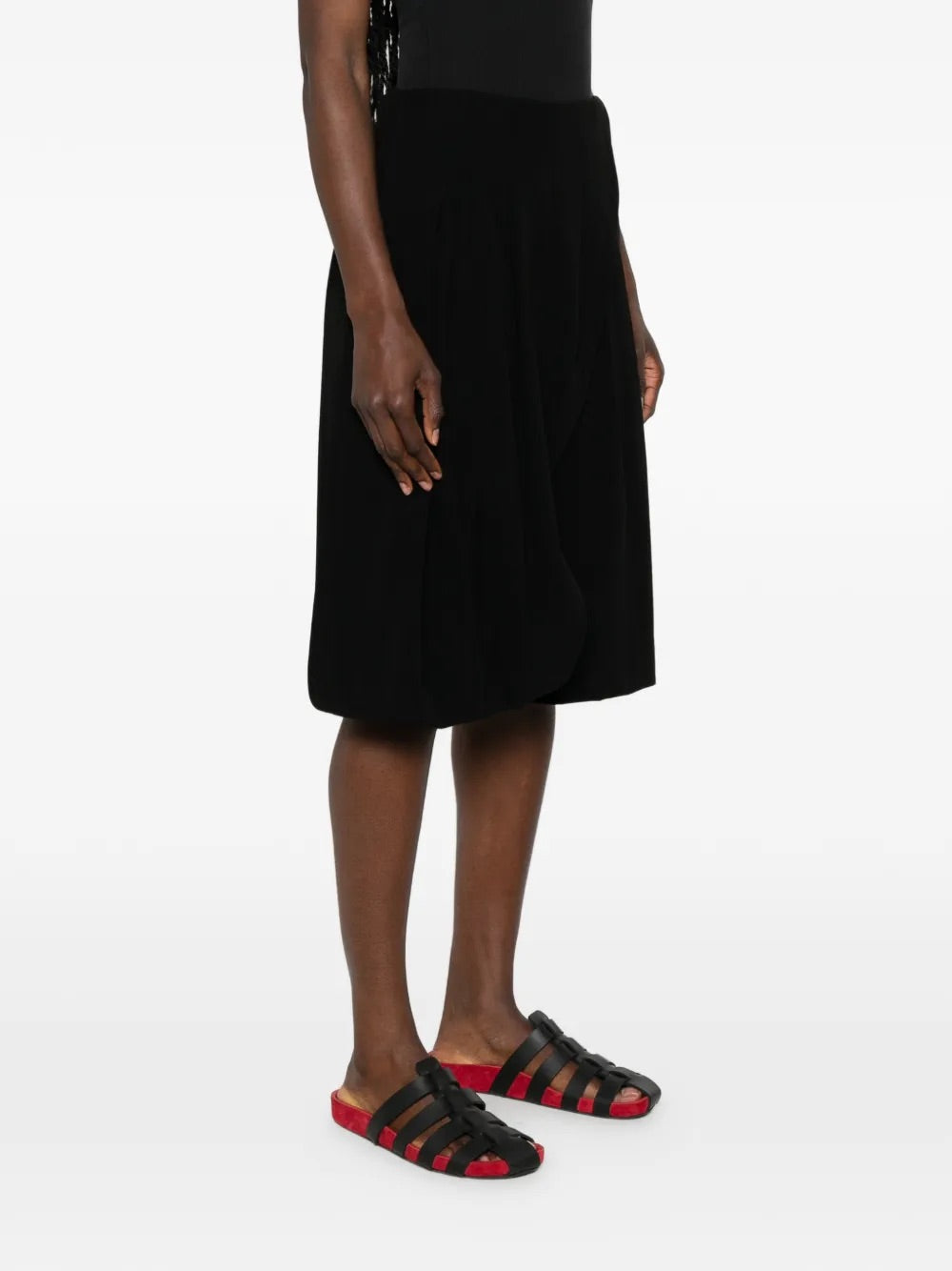 Issey Miyake April SS26 Looped Pants in Black worn on model rear view