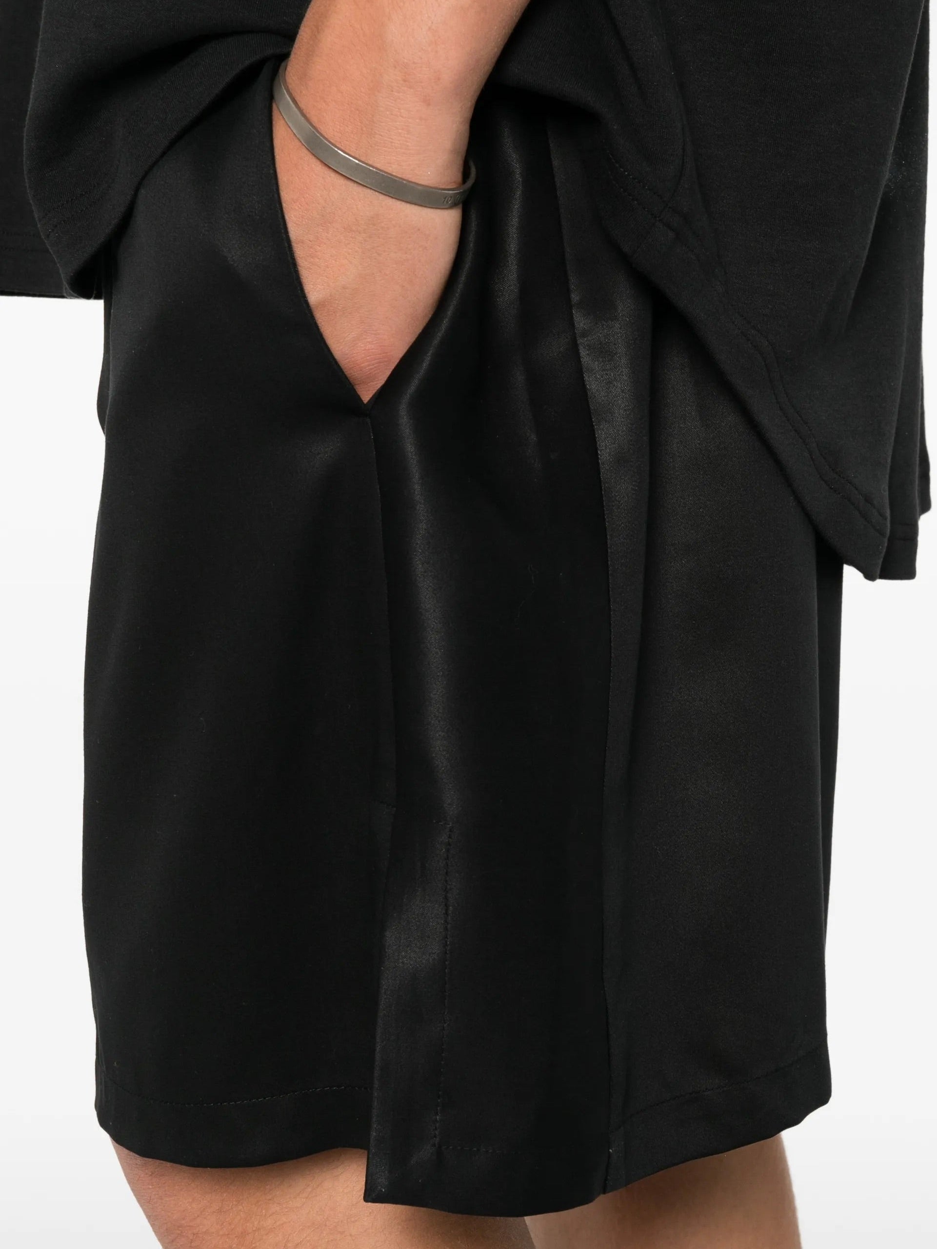 House Of The Very Islands Asher Pants in Black - detail view showing side pocket and satin-finish TENCEL fabric