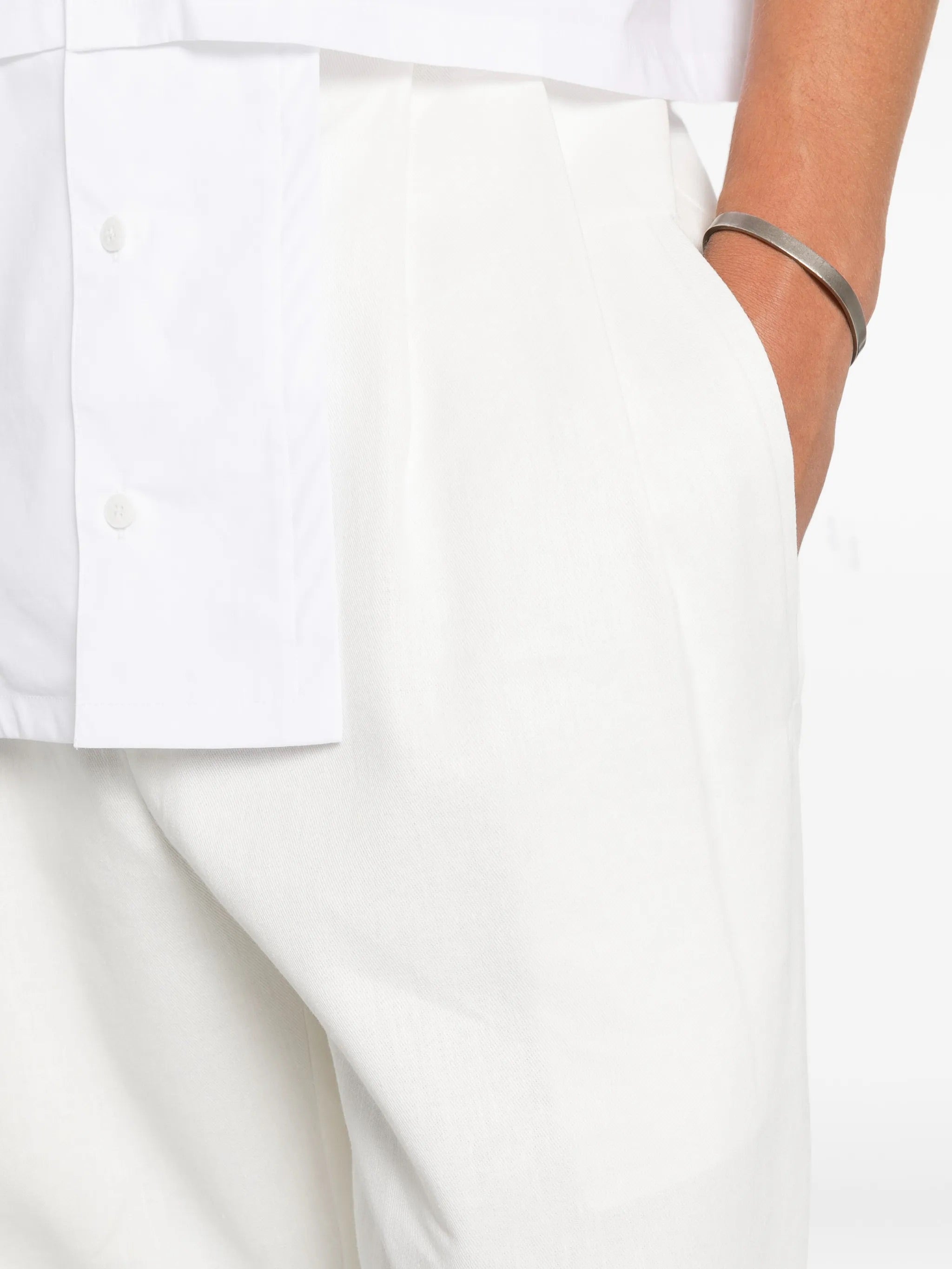 House Of The Very Islands Blake Trousers in Off White - detail view showing pleat detail and organic cotton hemp blend fabric