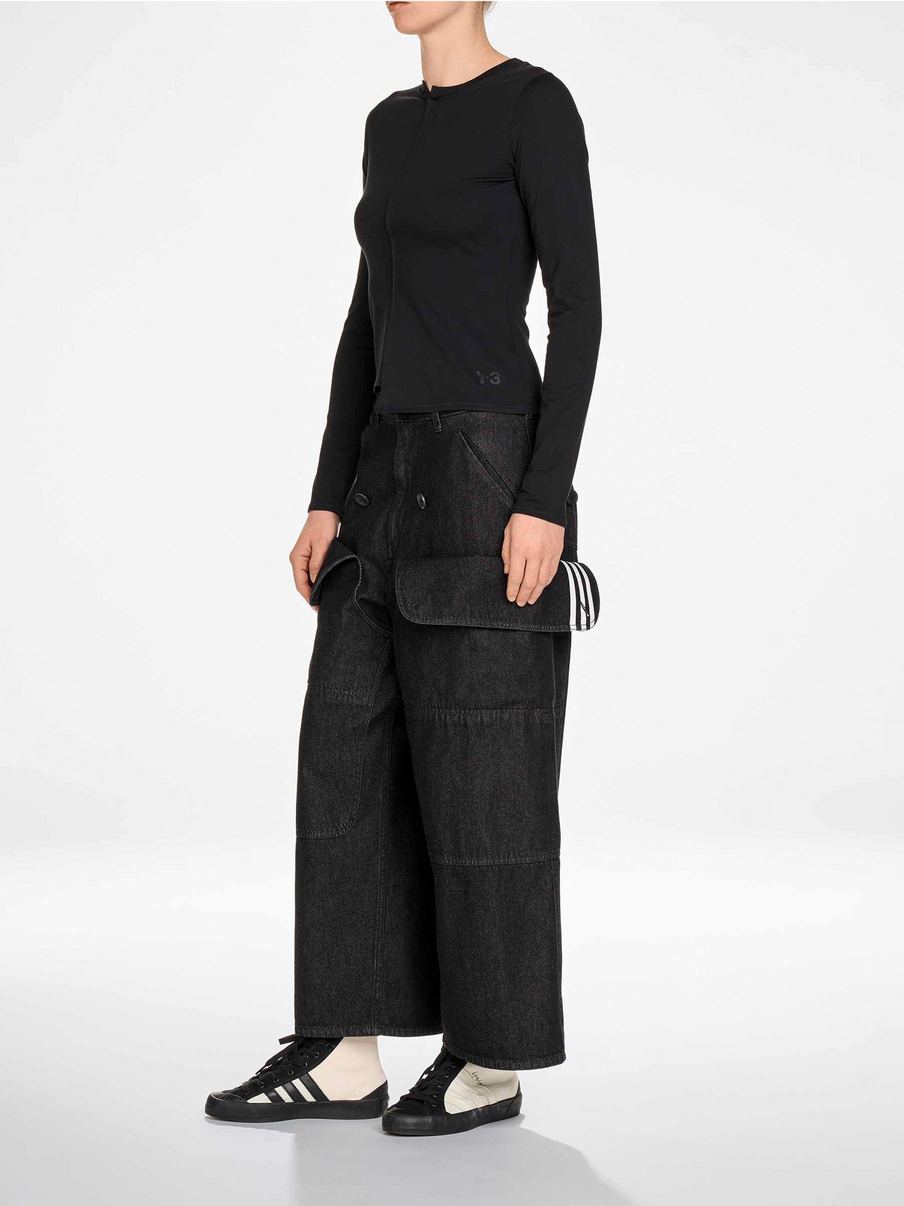 Side view of the model wearing the Y-3 Fitted Long Sleeve Tee in Black.