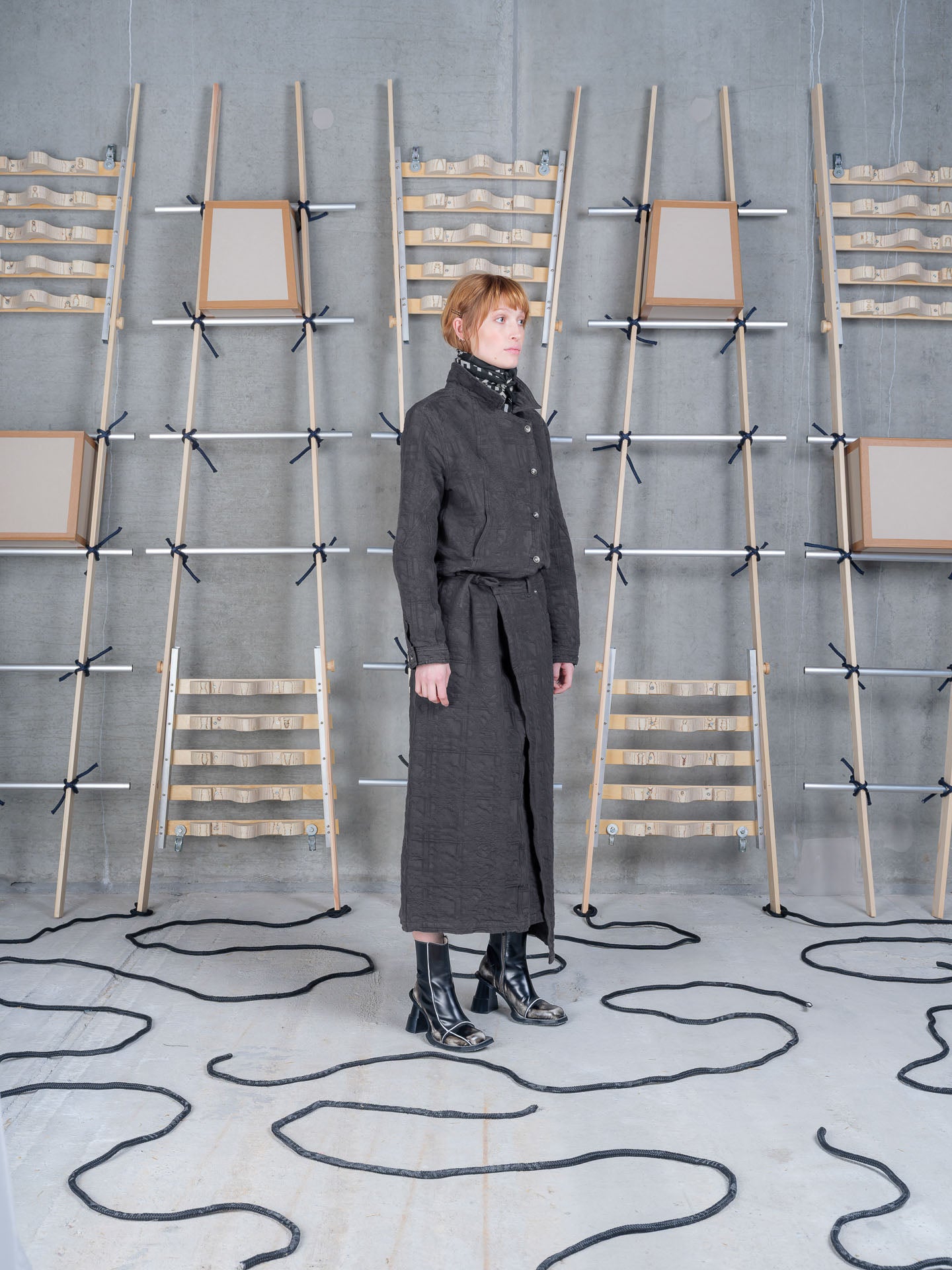Model wearing Fly Skirt in Black by Henrik Vibskov three-quarter view