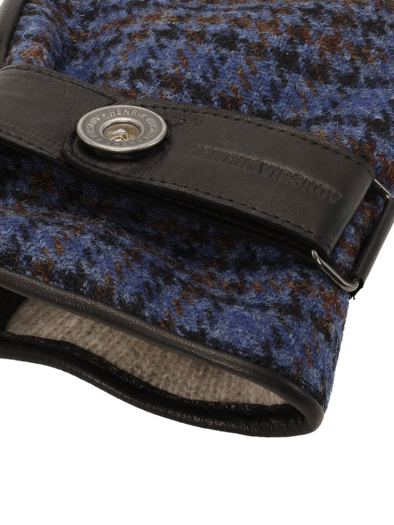 Close-up of Henrik Vibskov HV Gloves in Blue Wool Checks highlighting the merino wool check pattern and snap-button cuff detail.