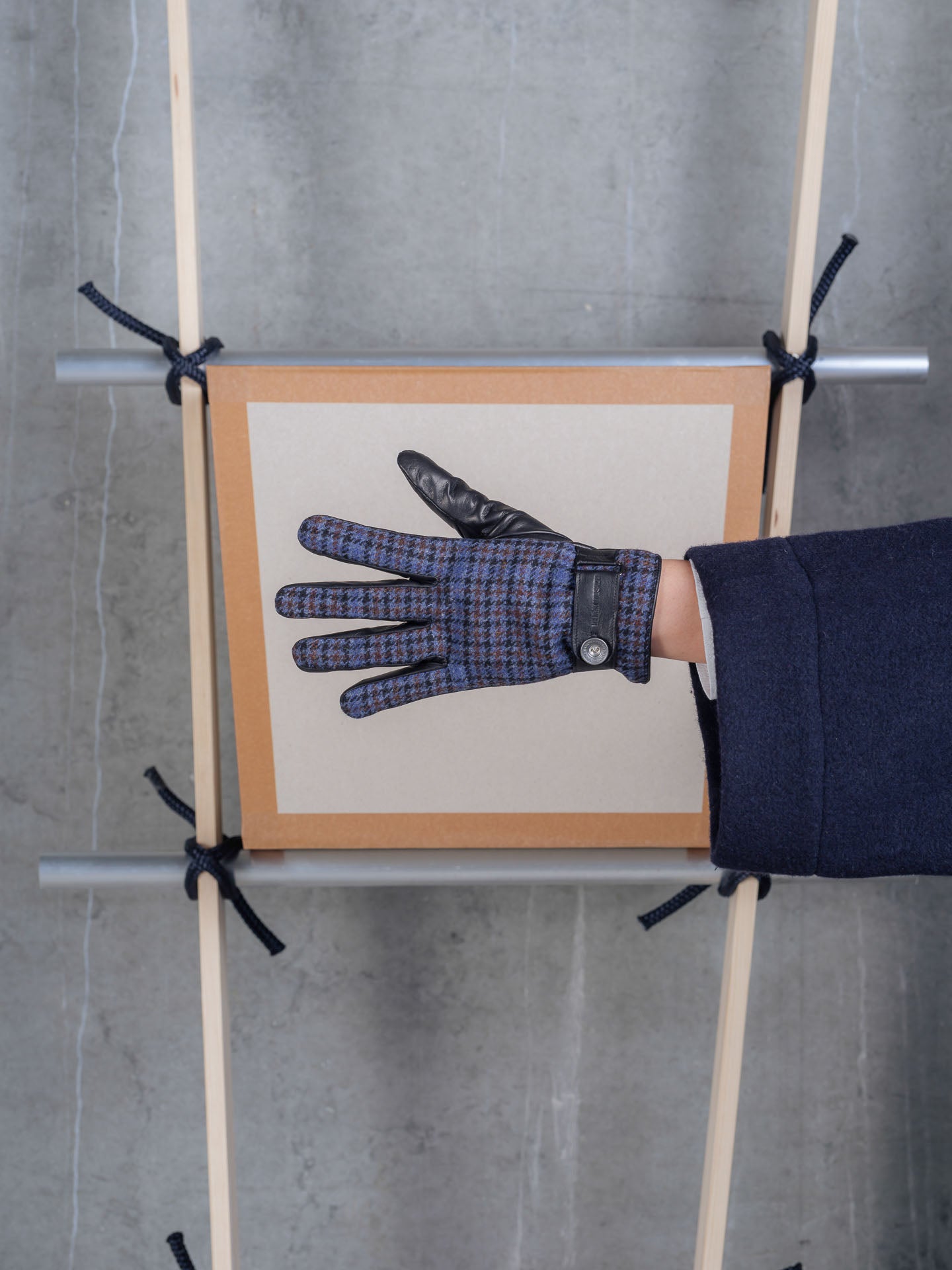 Top view of Henrik Vibskov HV Gloves in Blue Wool Checks worn, highlighting the blue check design and fitted silhouette.