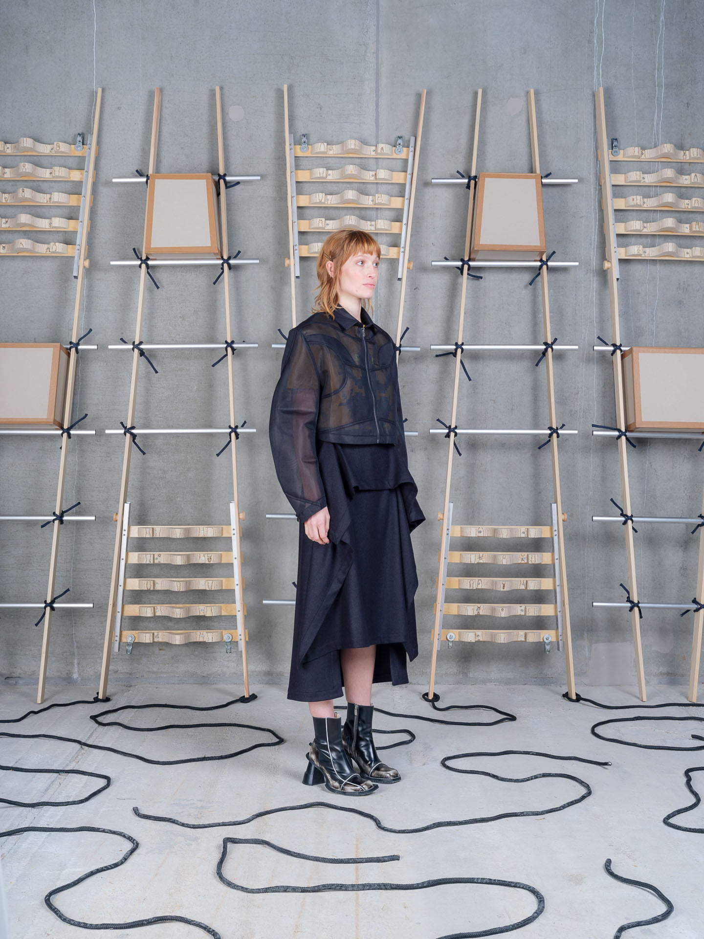 Model wearing the Henrik Vibskov Abstract Frog Blouse in black, side view
