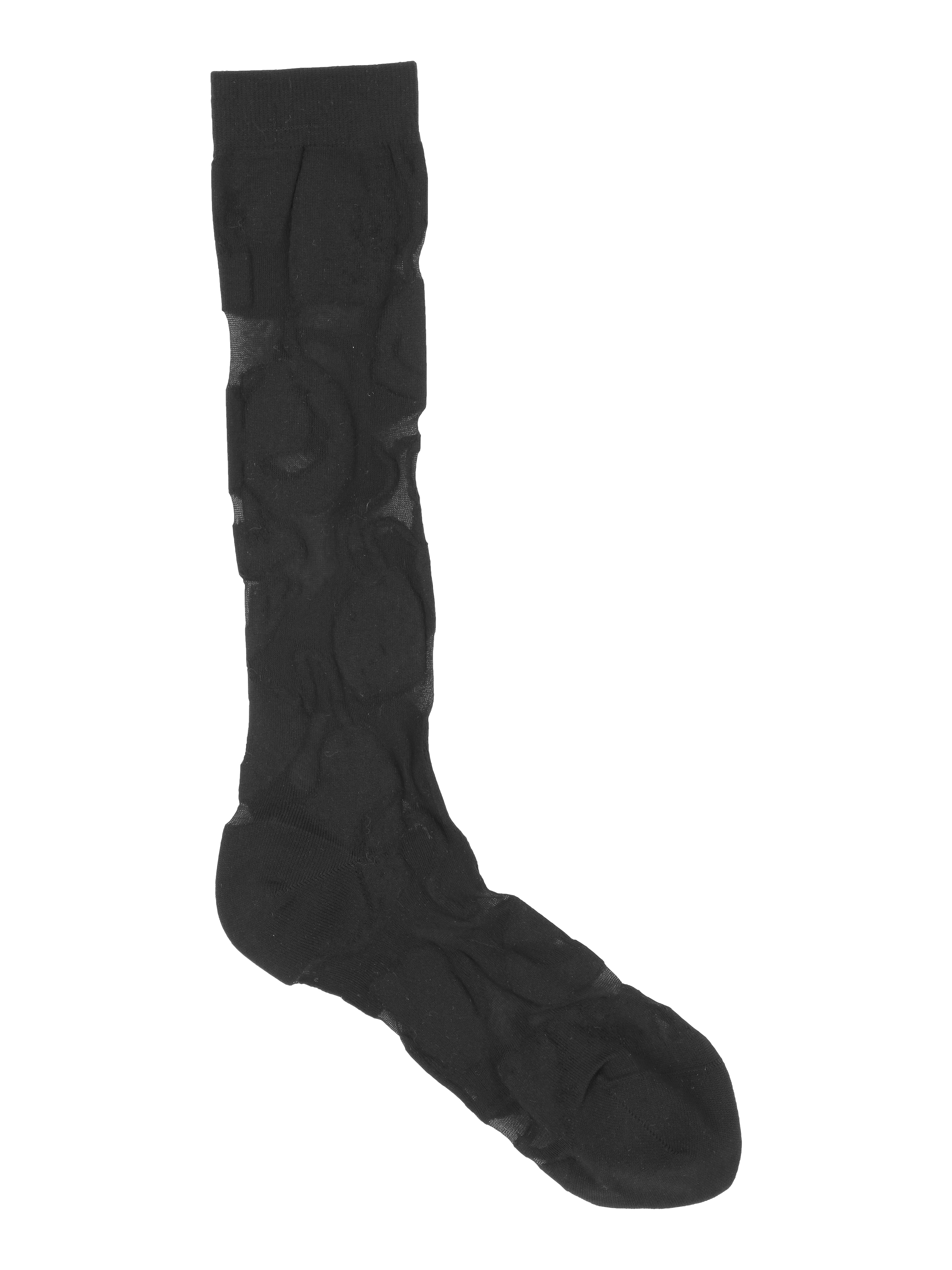 Packshot of the Amulet Long Socks in Black Amulets from Henrik Vibskov Spring/Summer 2026 Studio Collection, showing the tight-fitting black socks with thick black patterned details.