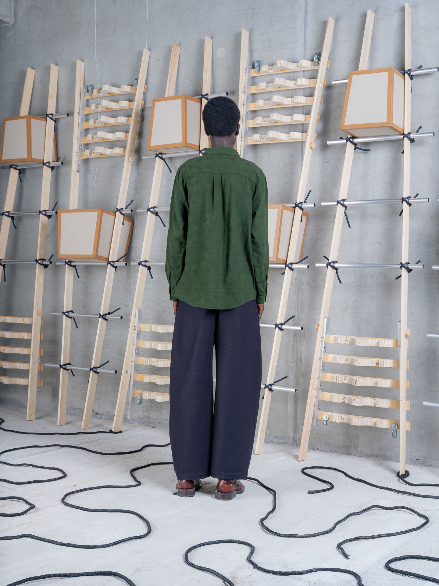 Henrik Vibskov Block Shirt Bottle Green, model rear view, showing back yoke and pleat detail