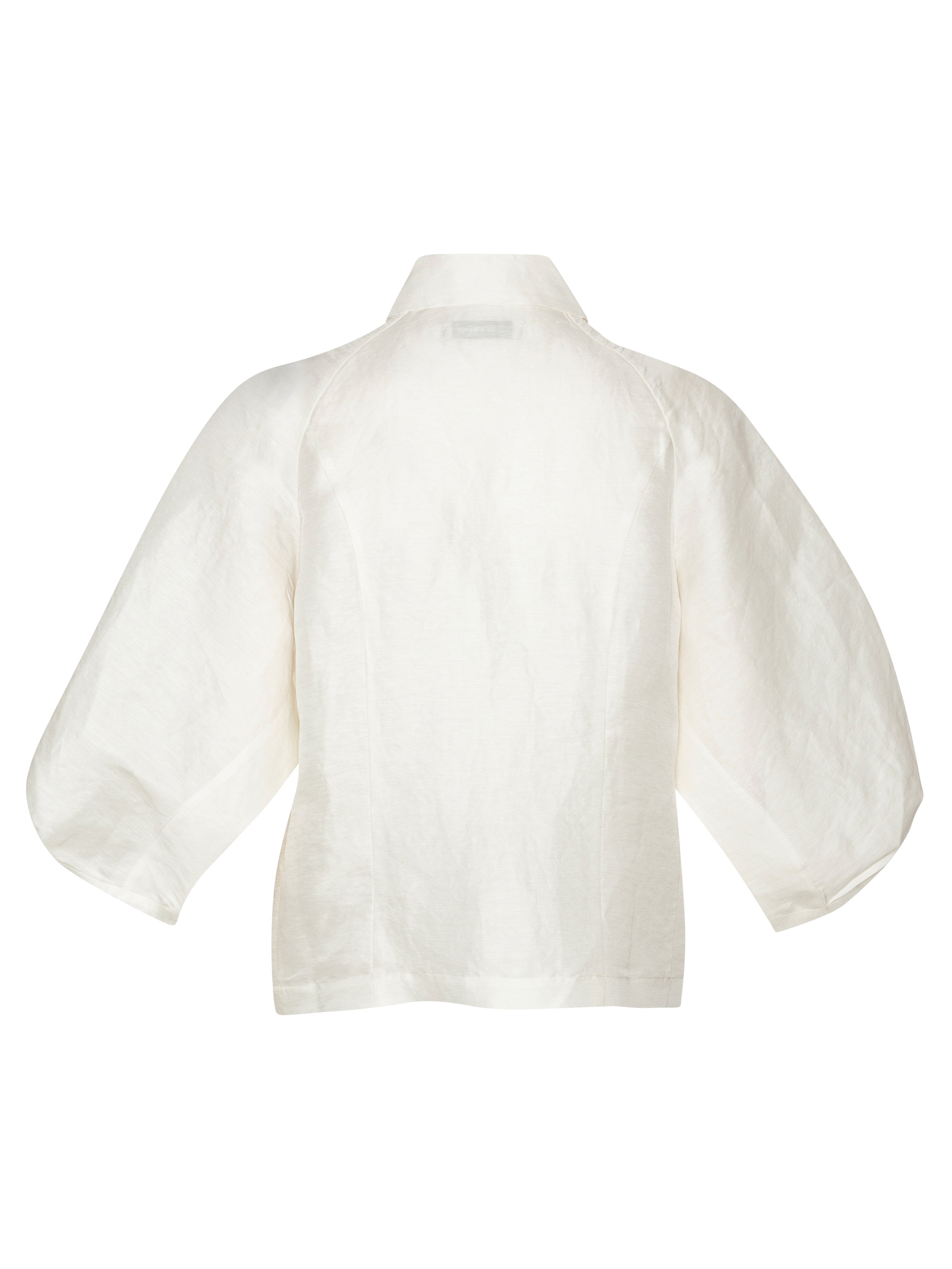 Back full-body packshot of the Case Shirt in White from Henrik Vibskov Spring/Summer 2026 Studio Collection, highlighting the clean white design, 3/4-length raglan sleeves, and straight back hem.