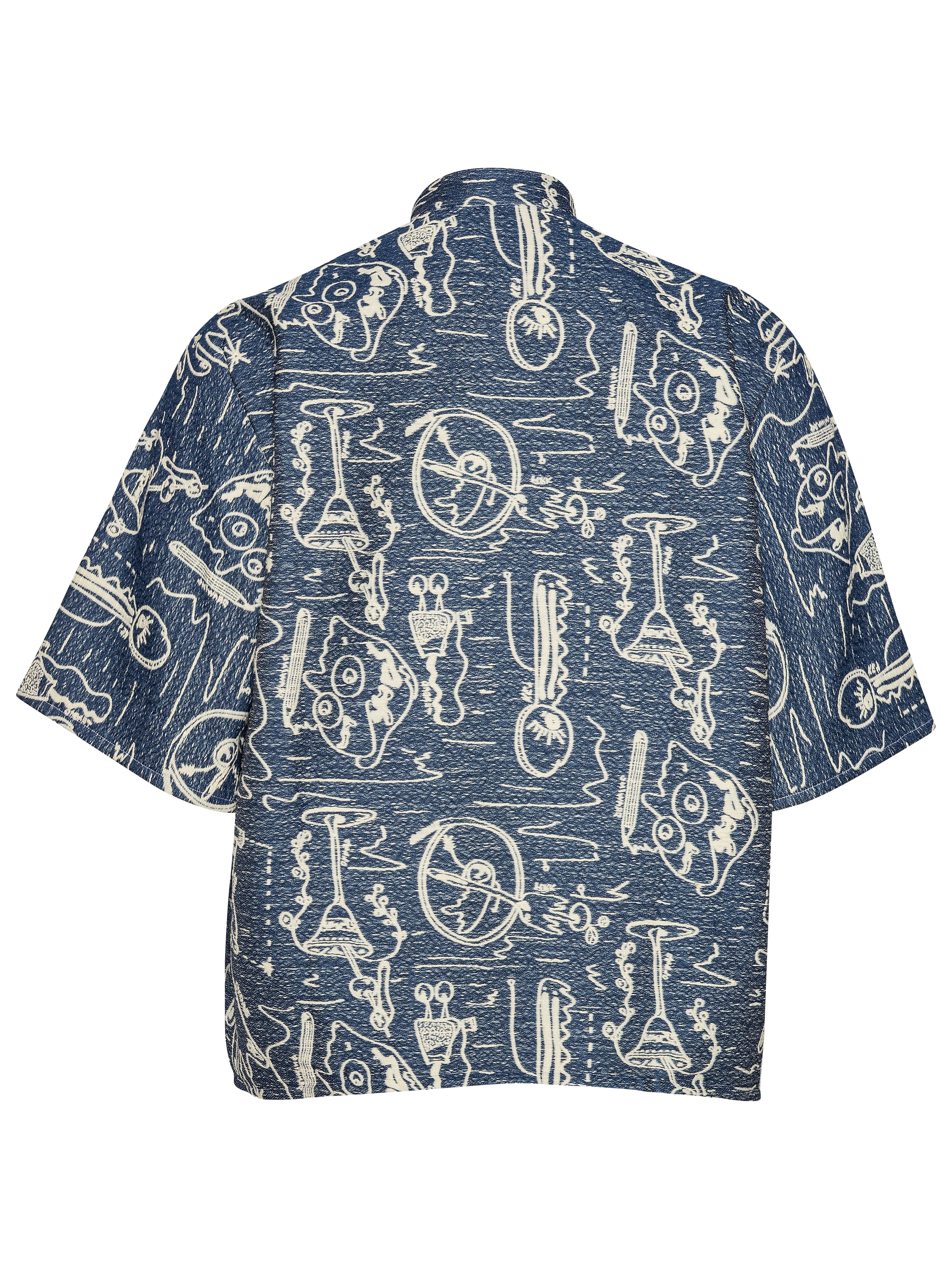 Back view of the Dart Polo Shirt displaying the full grey-blue surface with white doodle illustration and straight hem.