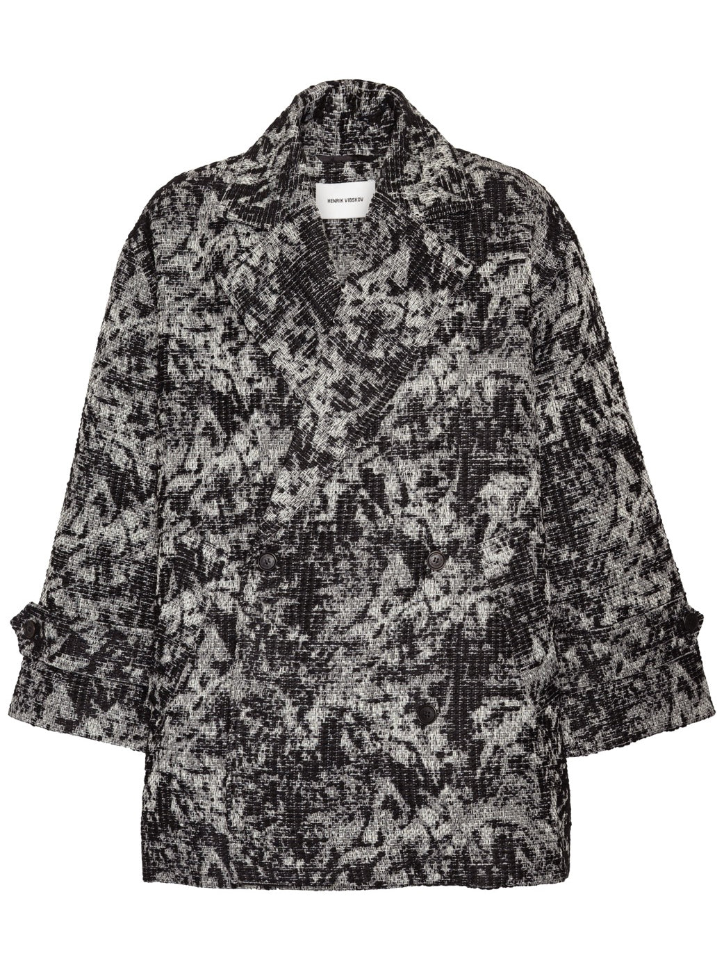 Henrik Vibskov Dimout Coat in Black 3D White, front view, textured jacquard tweed in raised black and white pattern, double-breasted fastening, notched lapel, turn-back cuffs, patch pockets, oversized fit