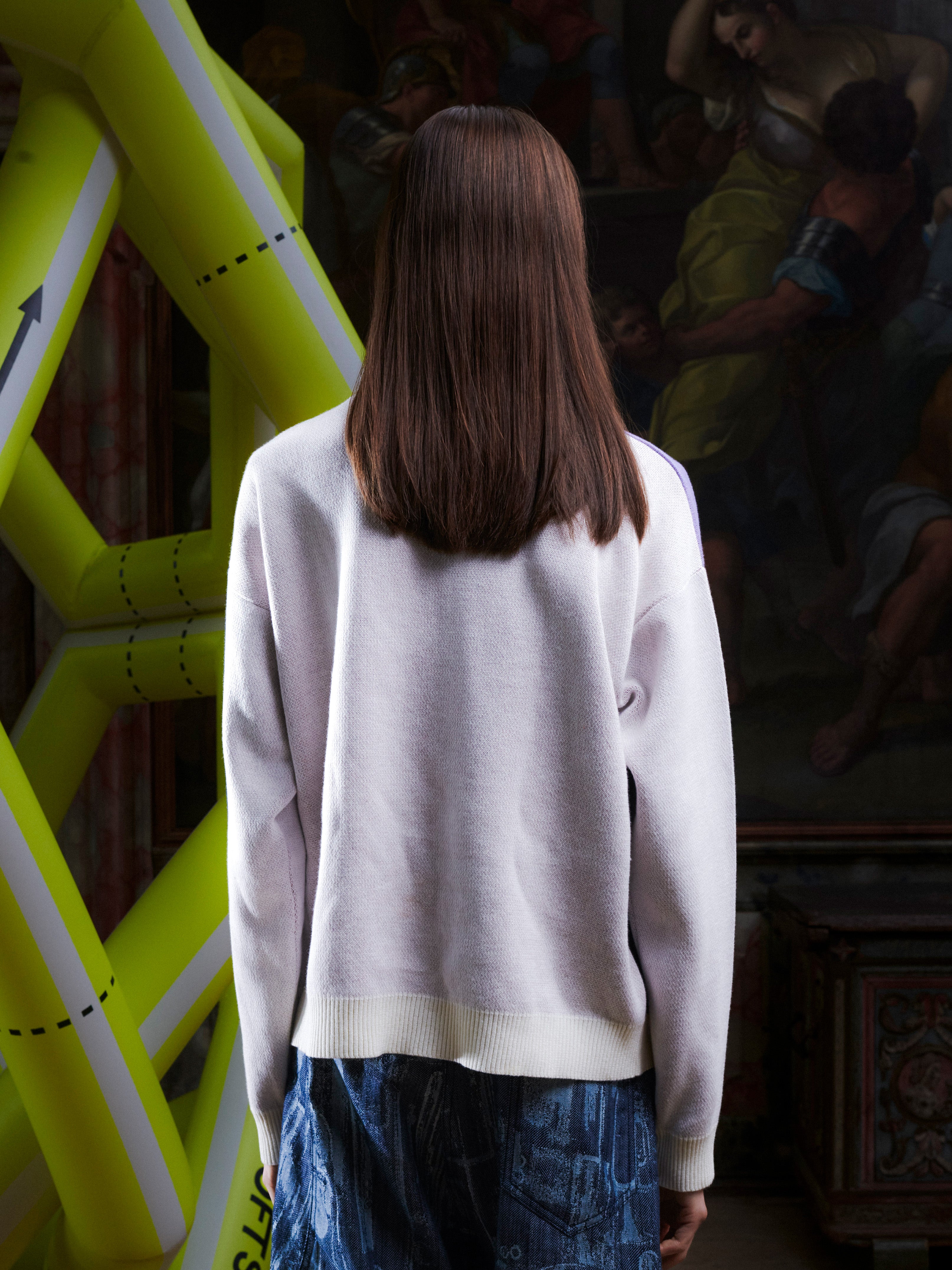 Female model wearing the Henrik Vibskov Frigate Crewneck in Frigate, back view, showing the clean off-white back and ribbed hem and cuffs.