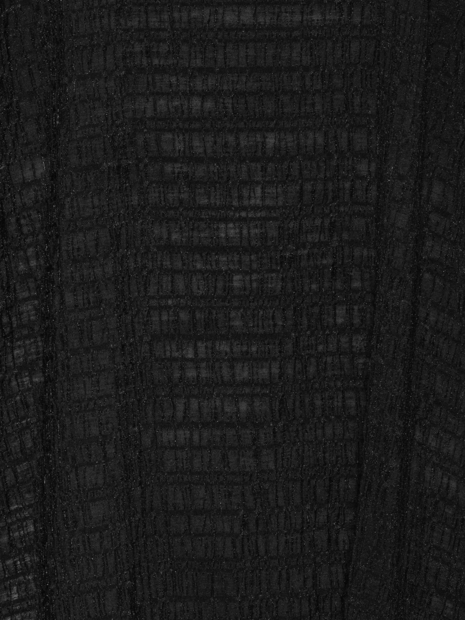Close-up of checkered pattern and textured fabric detail on the Octo Dress in Black loose-fit dress with curved sleeves – Henrik Vibskov Spring/Summer 2026 Key Collection