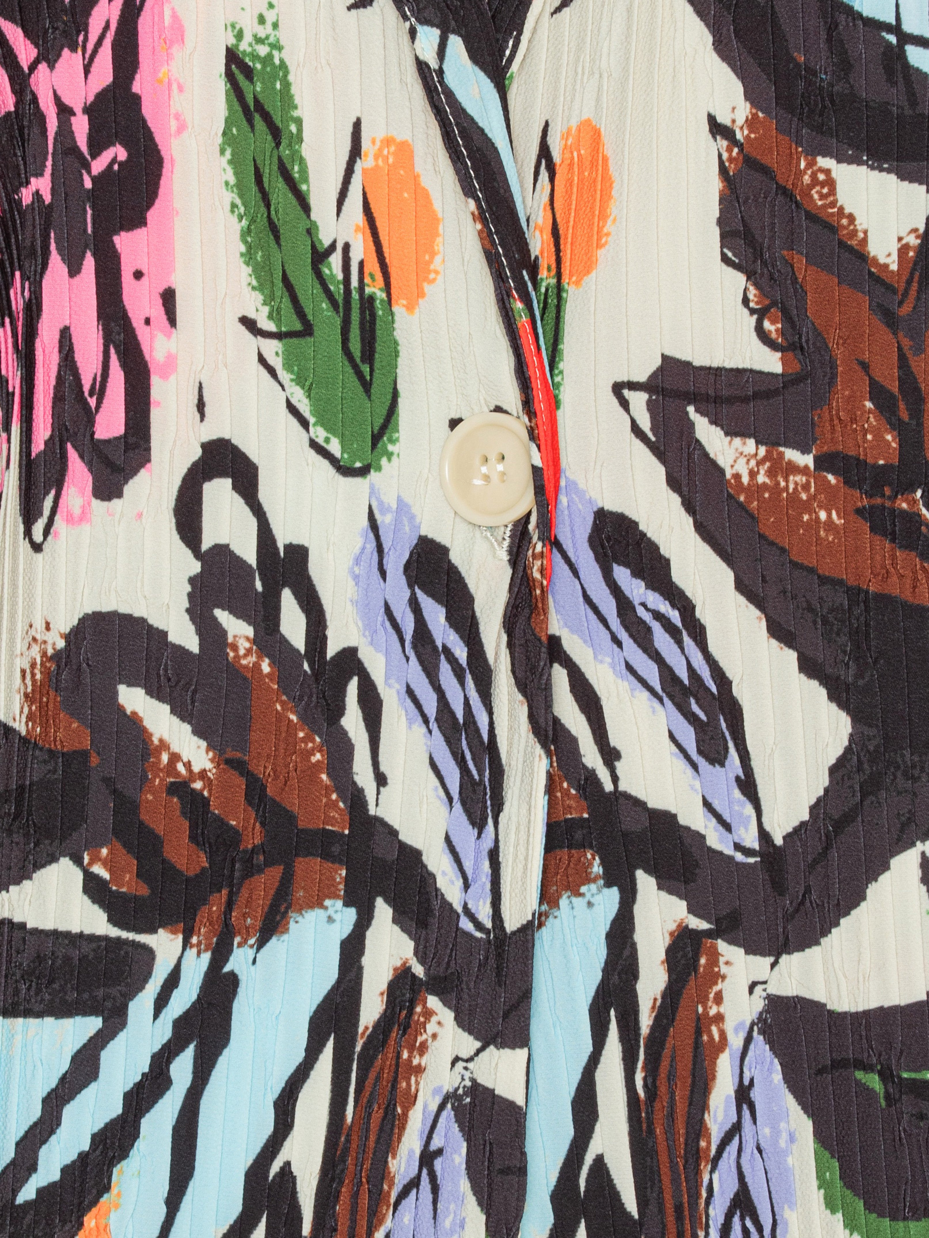 Close-up of the Henrik Vibskov Plissé Blazer in Carrots, highlighting the detailed root-vegetable illustration and the pleated plissé texture.