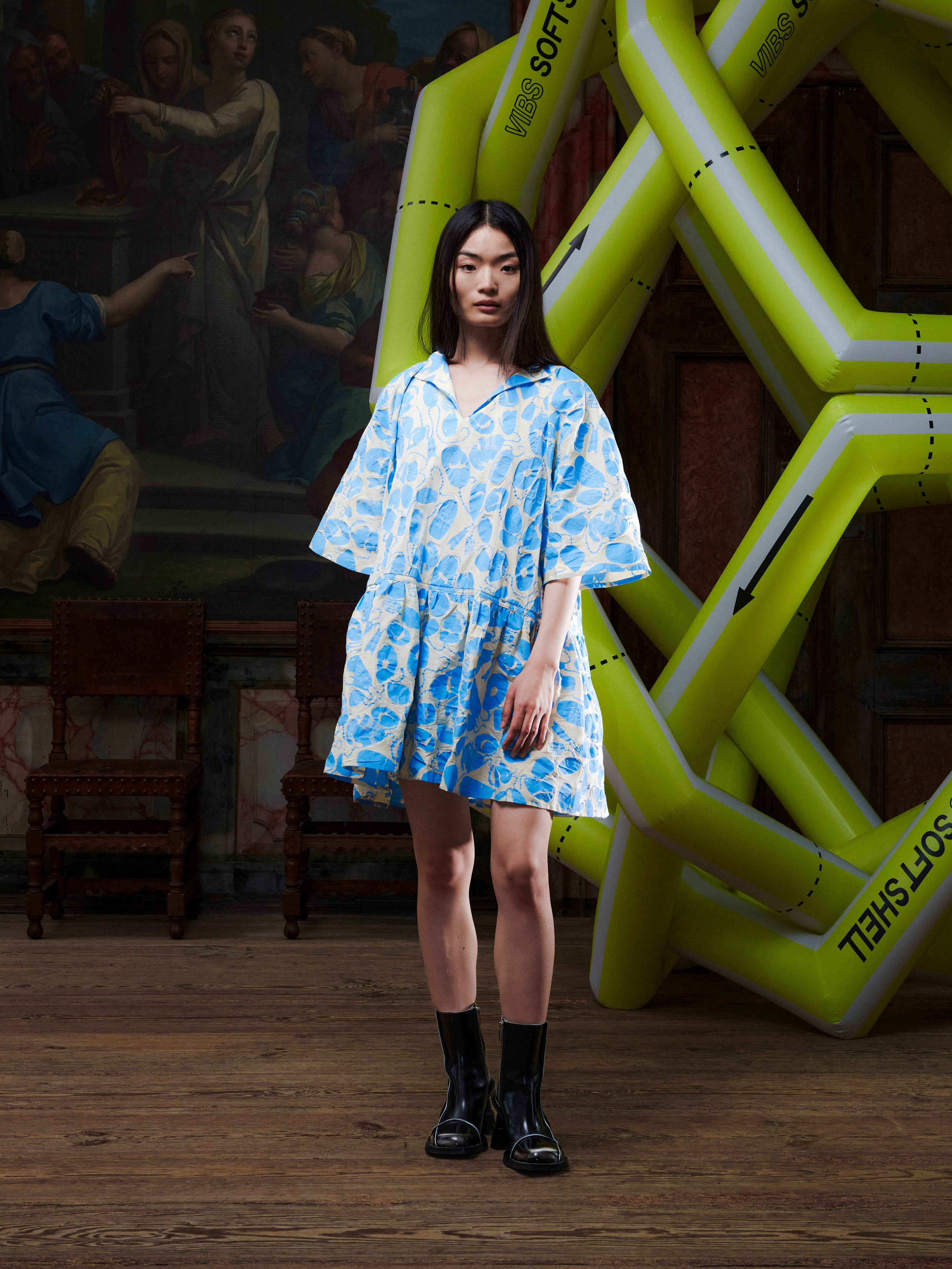 Model wearing the Henrik Vibskov Preserve Blouse in Ecru Amulets, front view. The model is 167 cm and wears size S, showing the oversized fit, V-neck with button, and wide, knee-length skirt.
