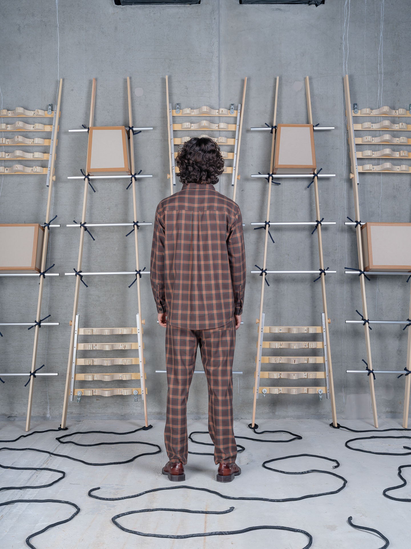 Henrik Vibskov Razor Pants Brown Cotton Checks, model rear view, showing back silhouette and fit