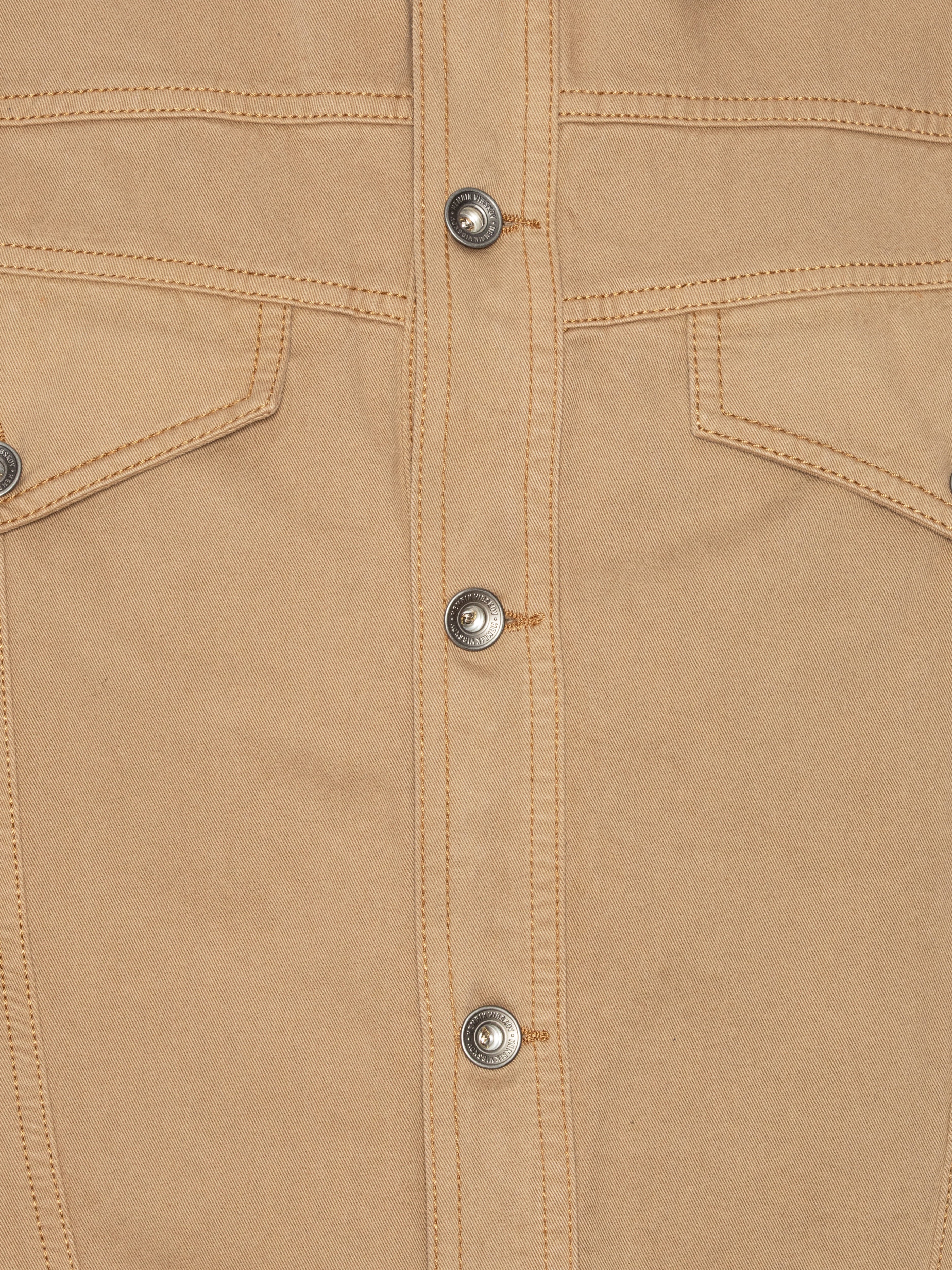 Close-up of the dark beige denim jacket from Henrik Vibskov on a white background