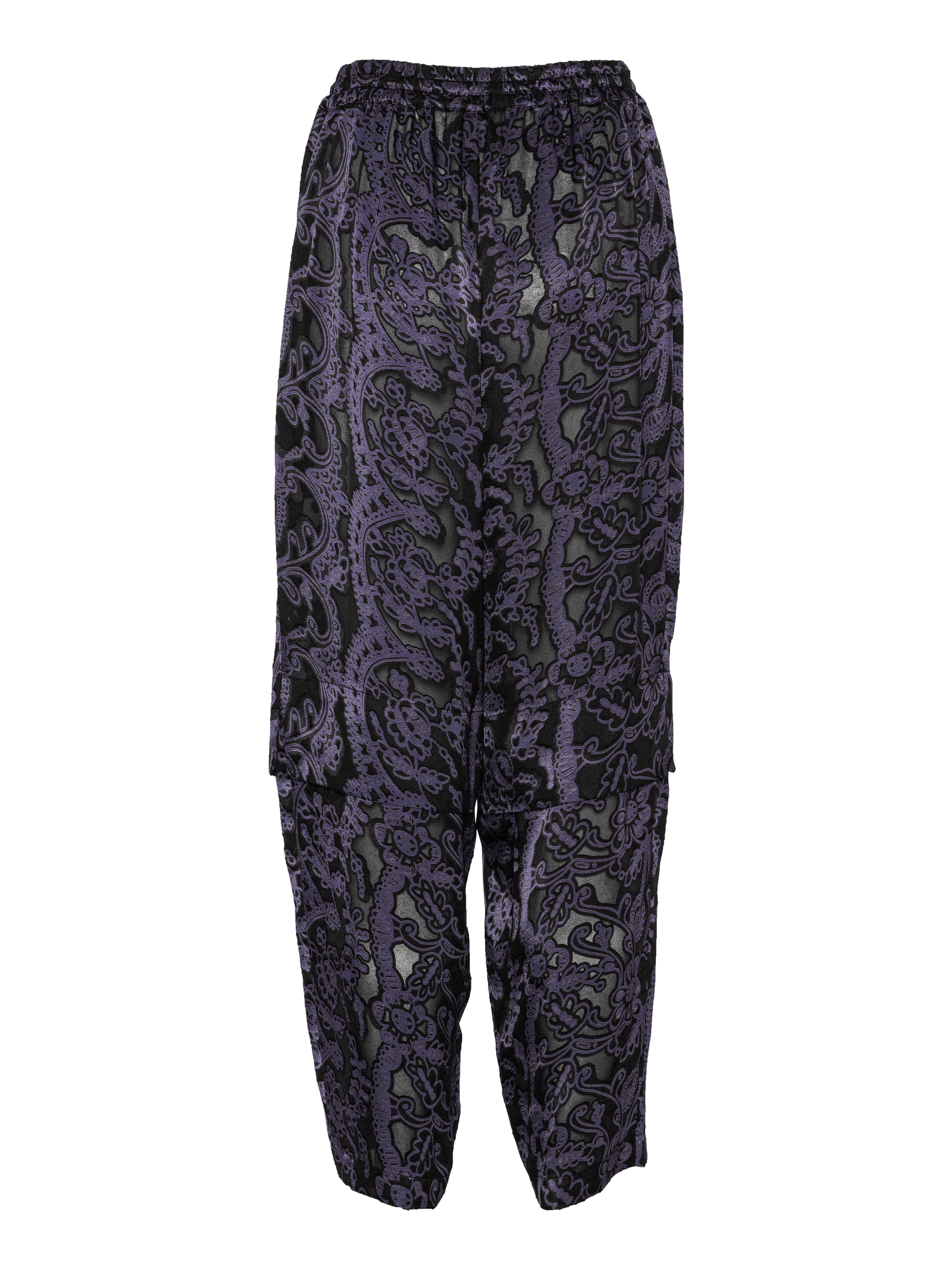 Back view of the Shants Pants featuring elastic waistband with drawstring and straight layered leg construction.