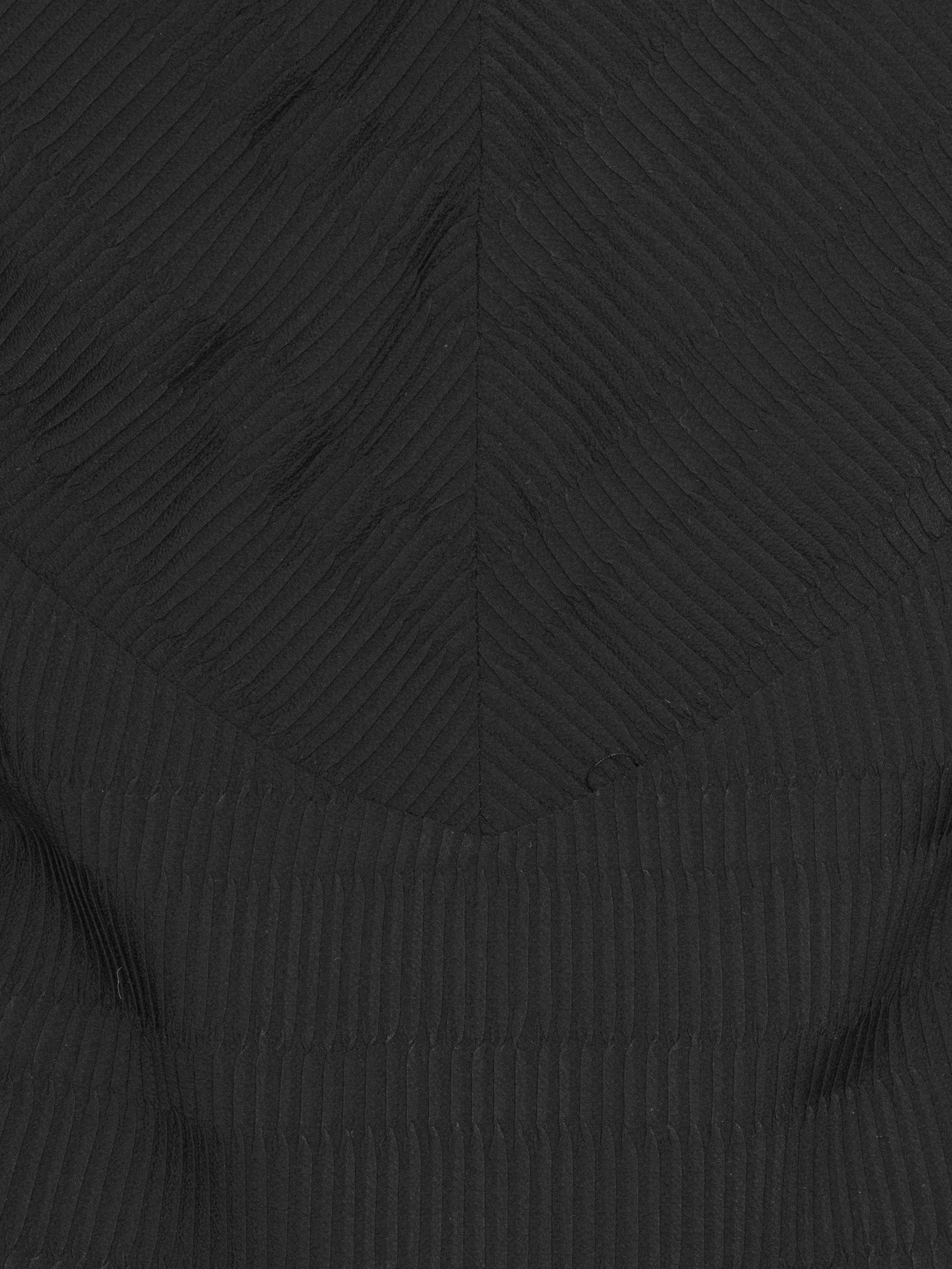 Close-up of pleated blouse