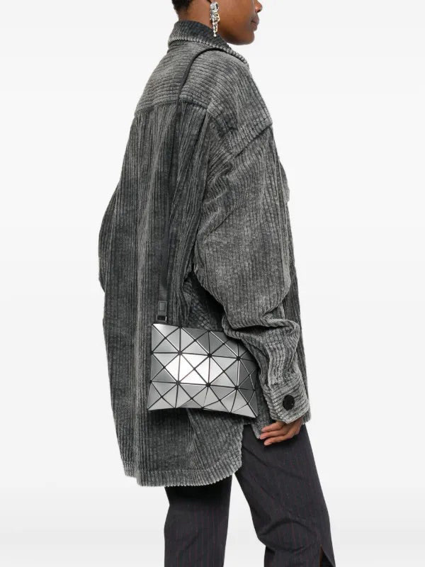 Bao Bao Issey Miyake August AW26 Lucent Shoulder Bag 3x4 in Silver, worn with glossy geometric panel design