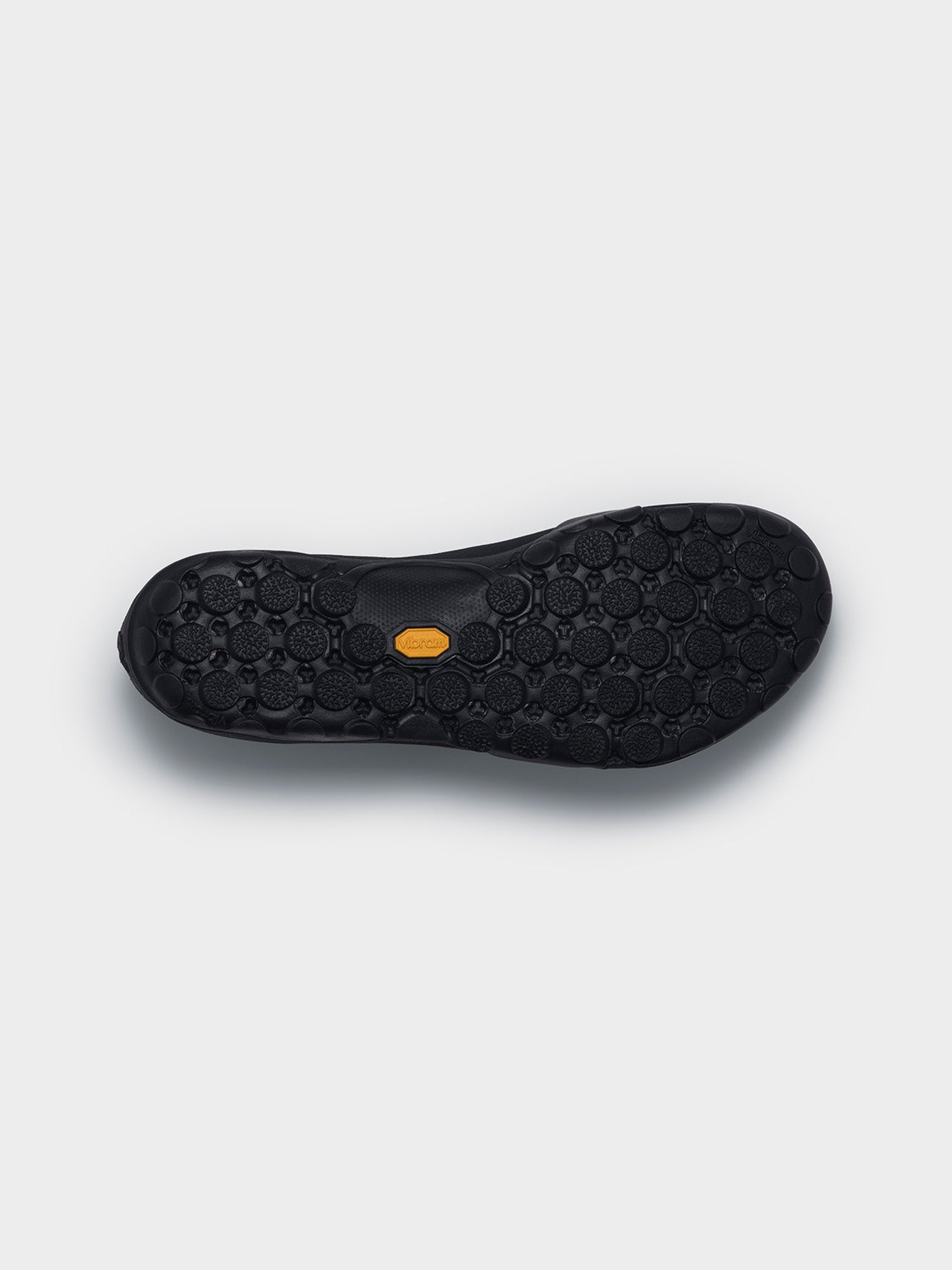 Junya Watanabe x New Balance MT10T sneakers in black, sole view, Vibram® rubber outsole with rounded multi-directional lugs