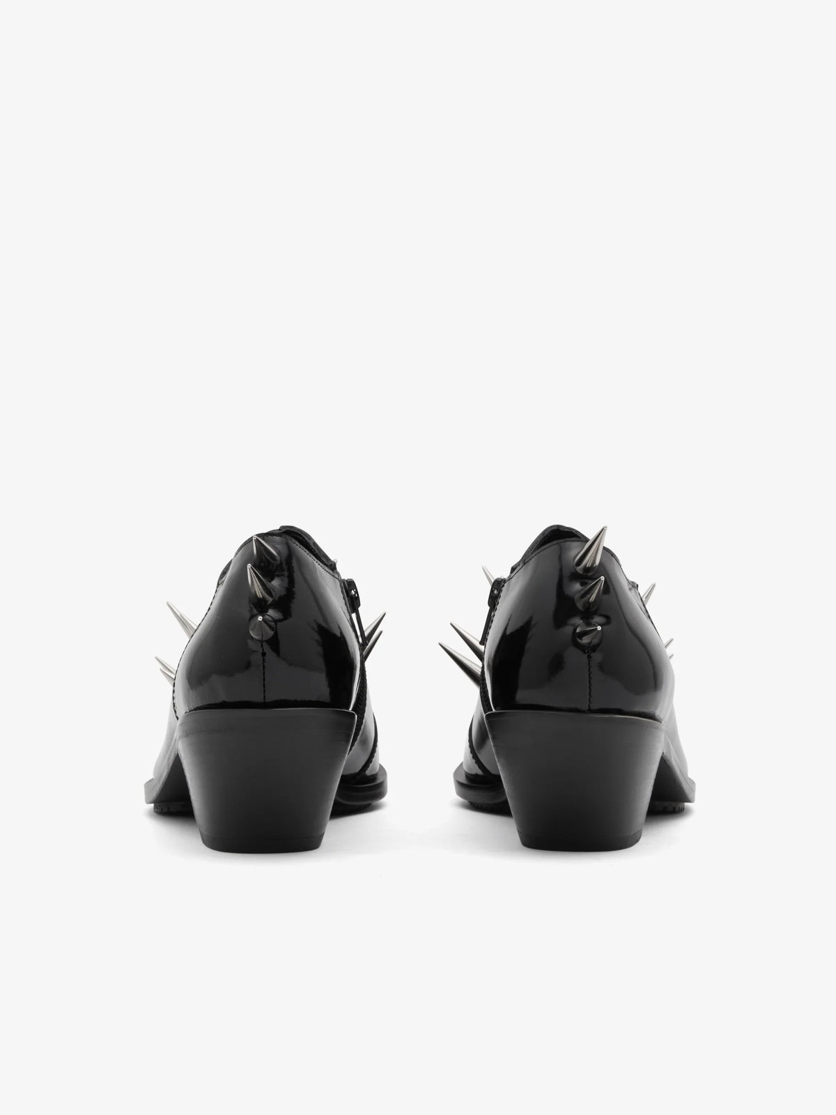 Junya Watanabe Women's Spiked Leather Shoes in Black, back view showing the heeled outsole and spike detailing at the heel.