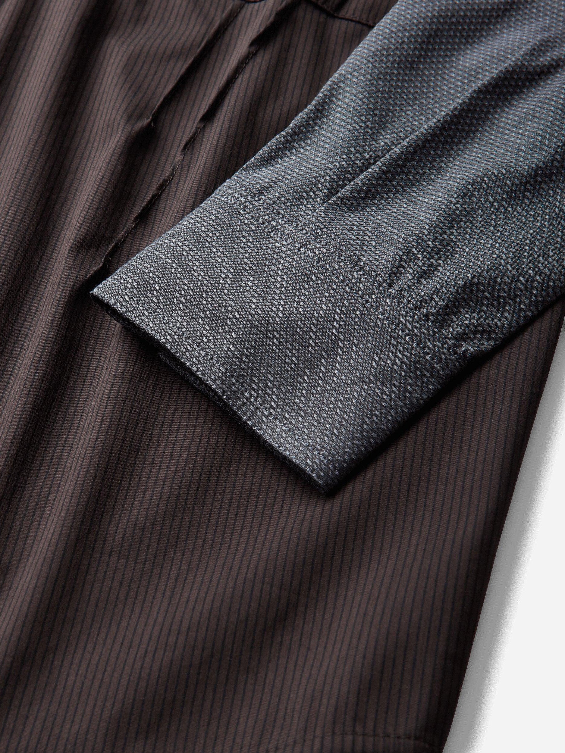 Kiko Kostadinov Woman Weka Shirt in Wood Brown Stripe, close-up of contrast grey cuff and wood brown striped fabric