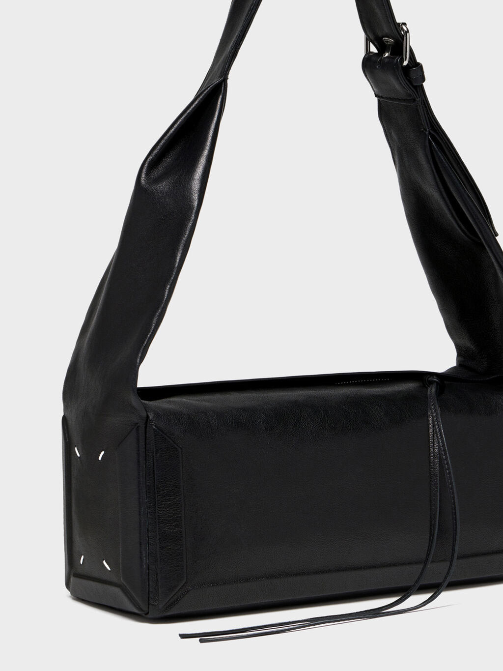 Close-up of Maison Margiela Box Bag East West Medium showing four white stitches, structured corners and leather tassel