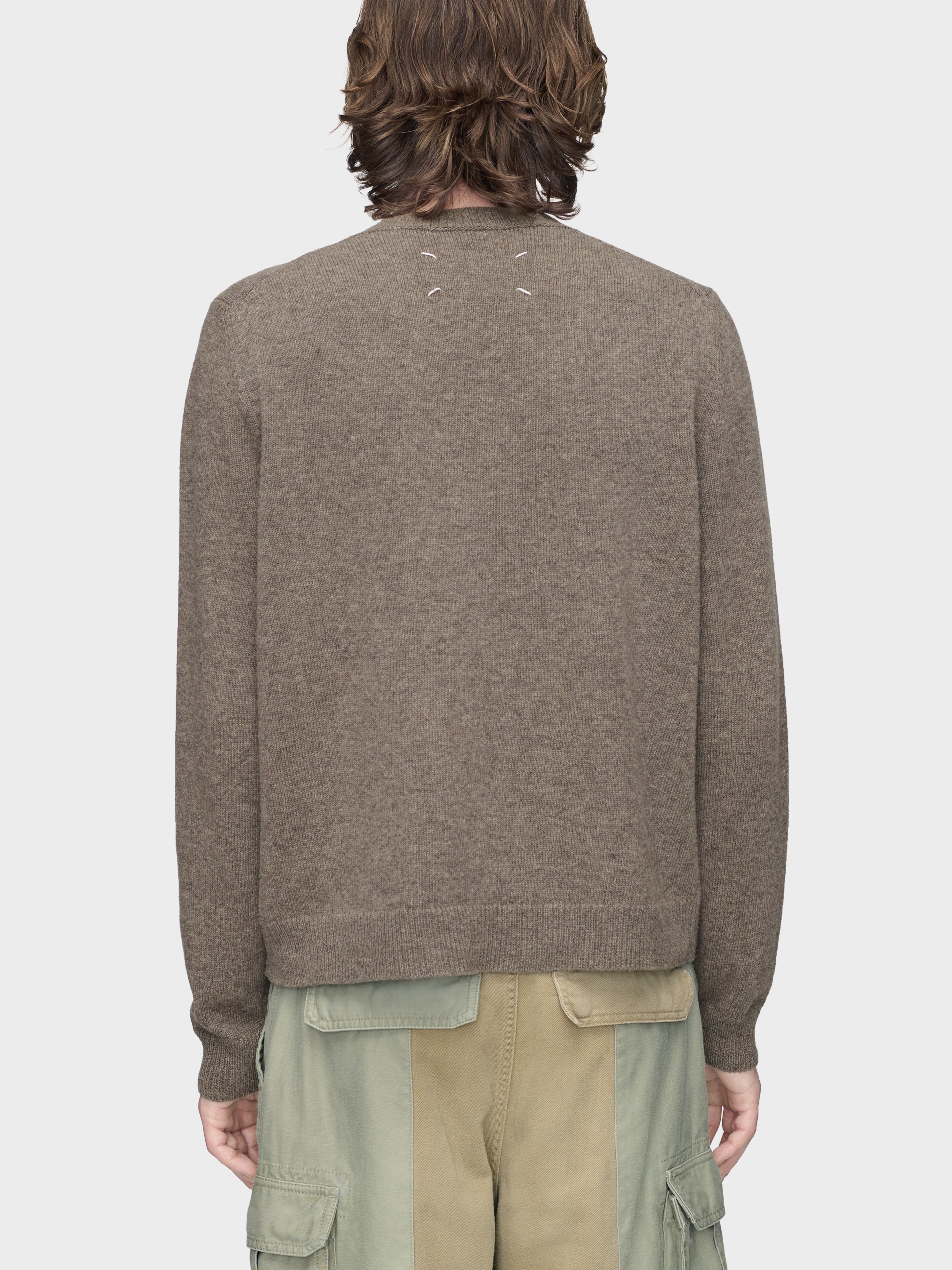 Maison Margiela Fused Knit Sweater in Mud Ecru on-model back view, signature four-stitch label, contrast ecru hem, ribbed cuffs and hem