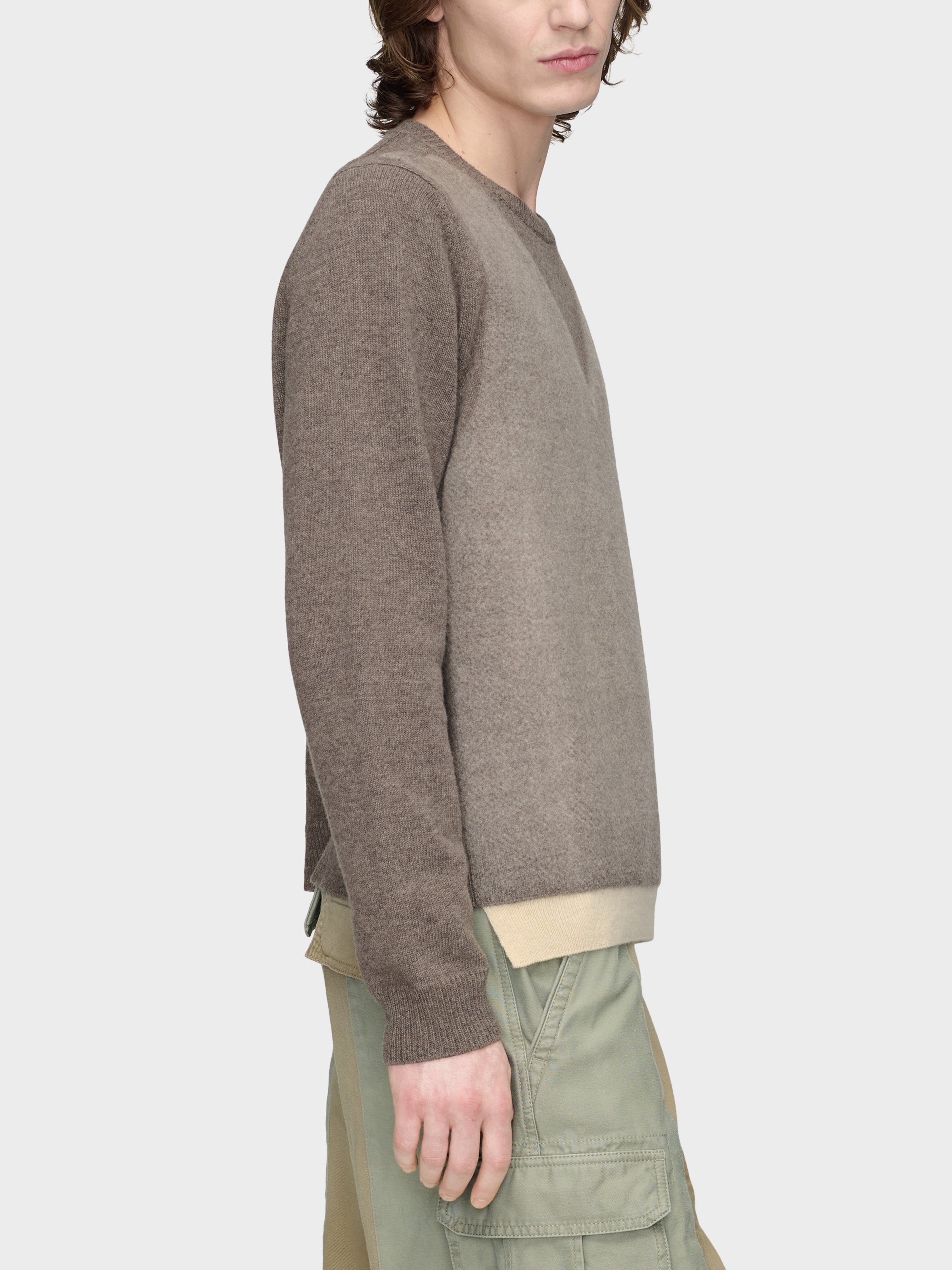 Maison Margiela Fused Knit Sweater in Mud Ecru on-model side view, lambswool construction, contrast ecru hem, ribbed cuffs