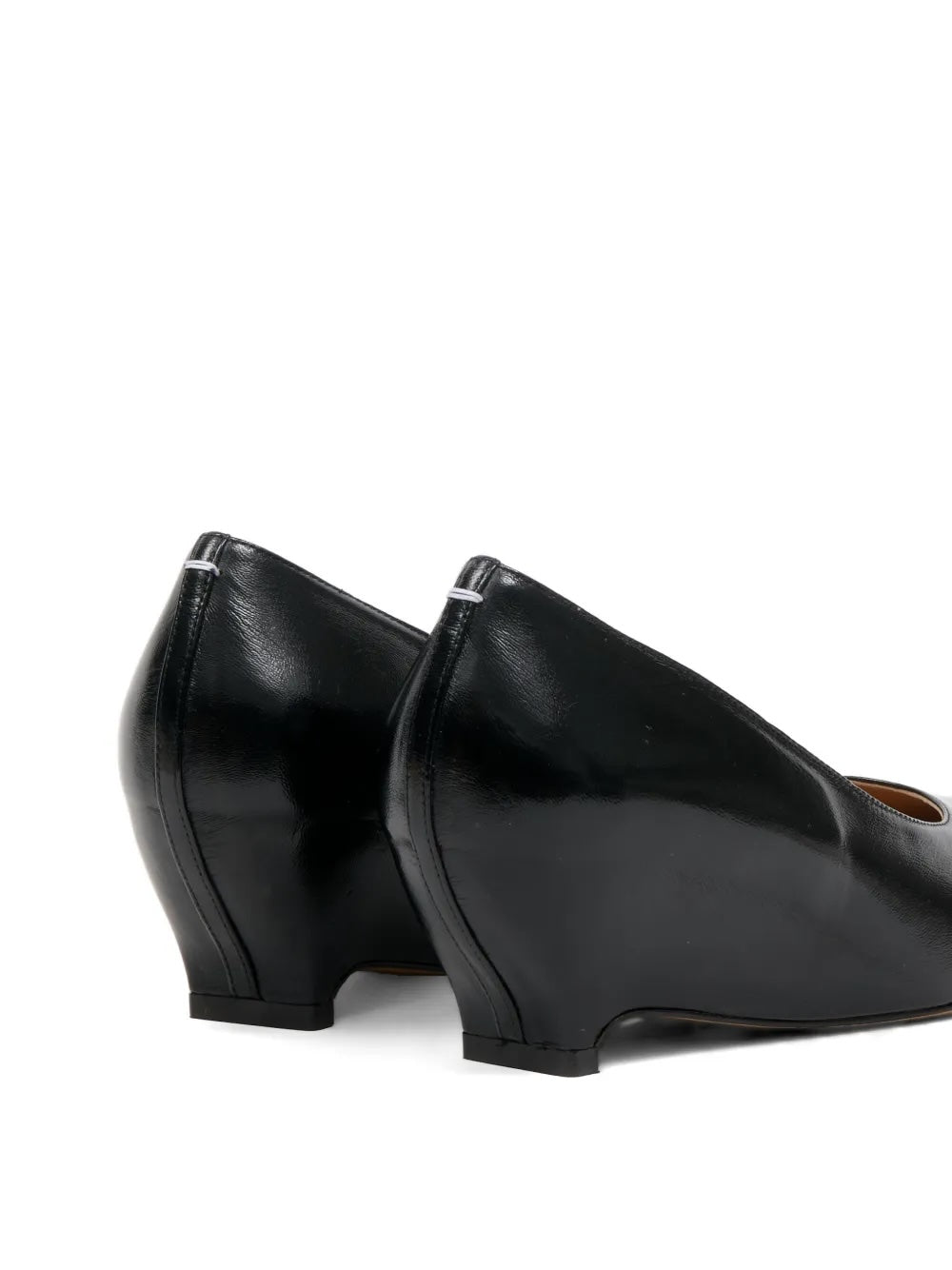 Maison Margiela Heel-Less Pump 55mm black, close rear angle highlighting the geometric wedge construction and Margiela stitch detail