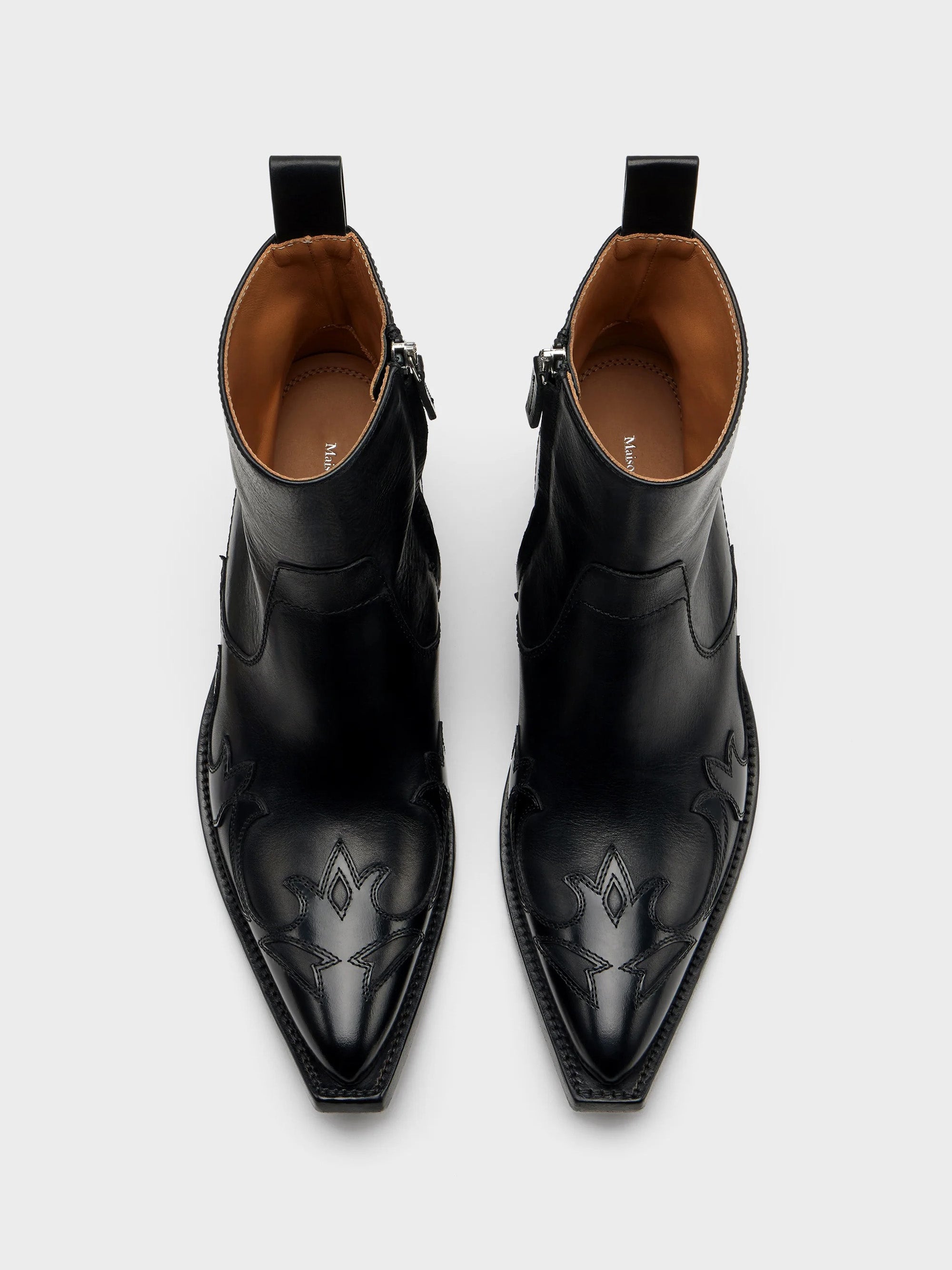 Top-down view of Maison Margiela Heel-Less Western Flame Boot pair showing flame appliqués and Maison Margiela insole