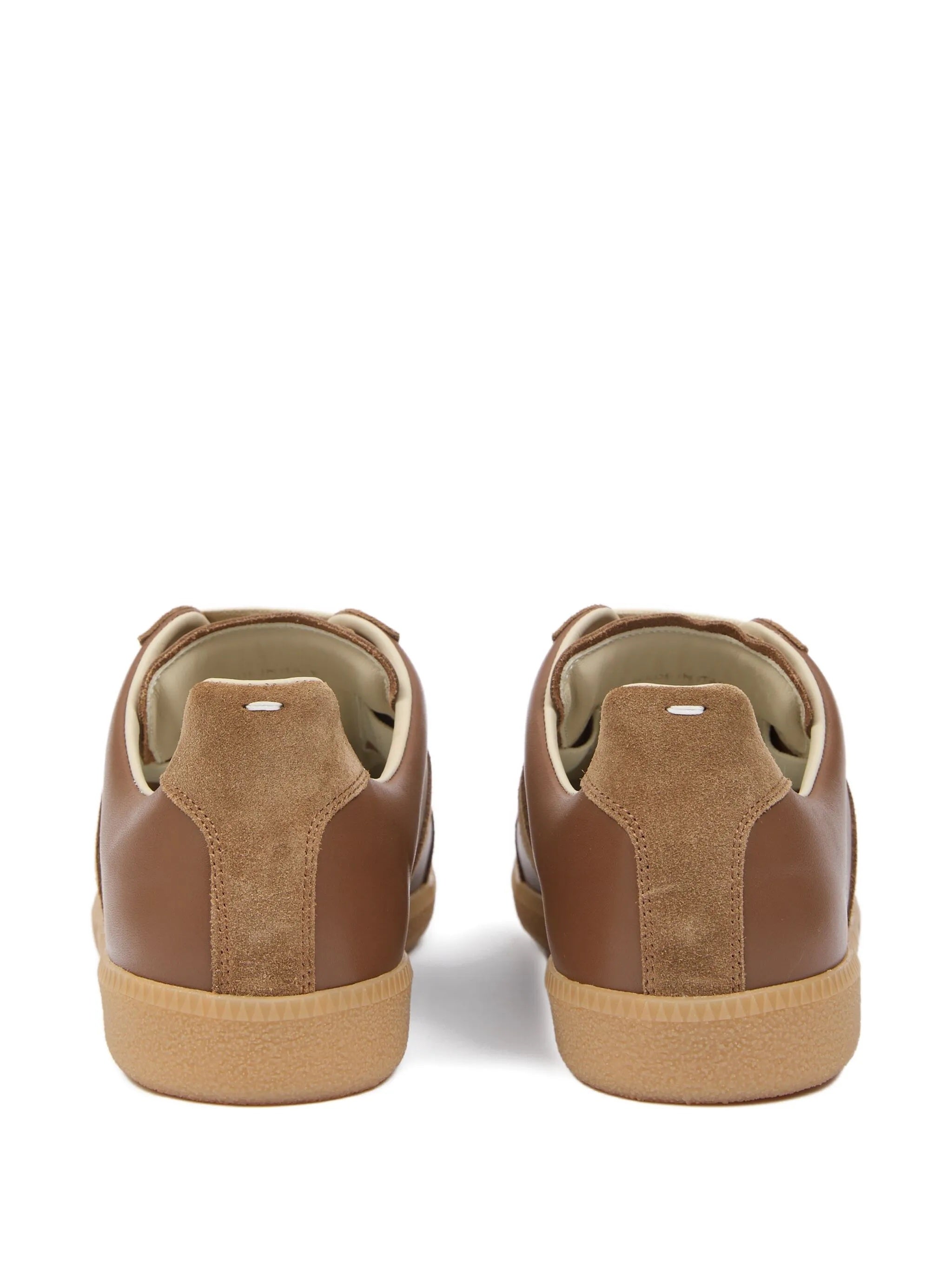 Back view of brown leather sneakers with white stitch detail from Maison Margiela on a white background