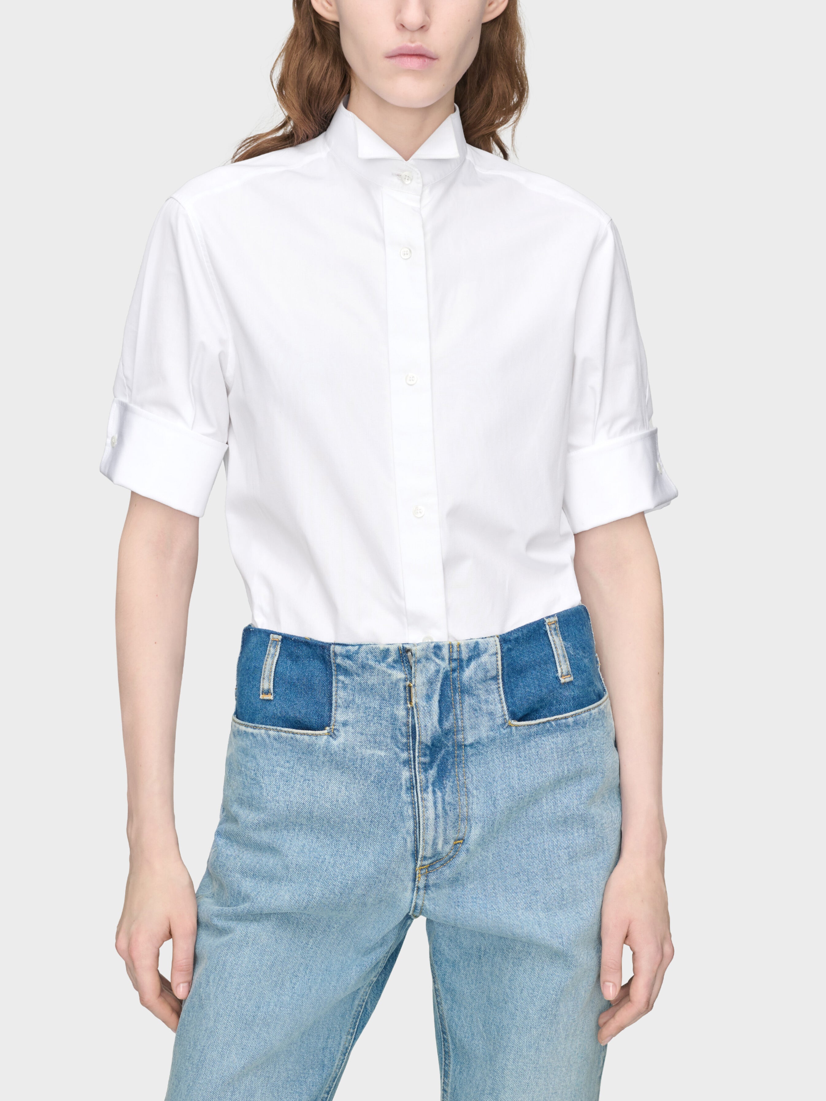 Maison Margiela Snapped Button Short Sleeves Shirt in White worn on model, front view, spread collar, button-front placket, turn-back cuffs, relaxed oversized fit