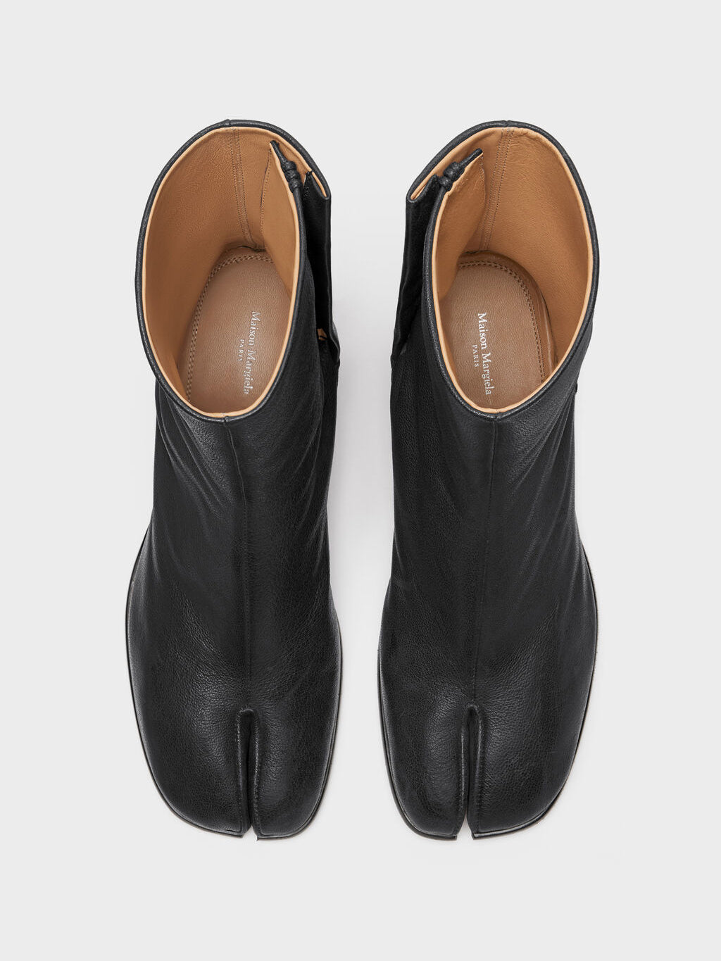 Maison Margiela Tabi Ankle Boot H60 in Black, top-down view, signature split toe detail, smooth ovine leather, leather-lined interior visible