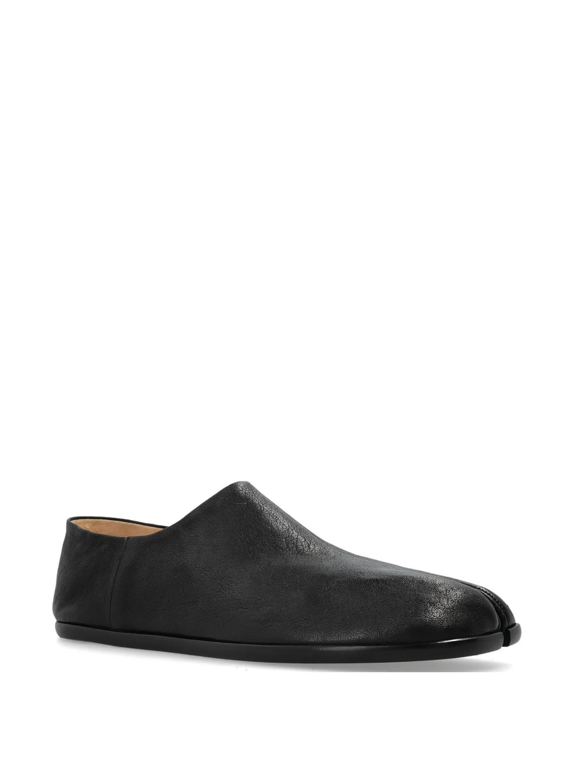 Maison Margiela Tabi Babouches three-quarter view showing Tabi split-toe and grained leather texture