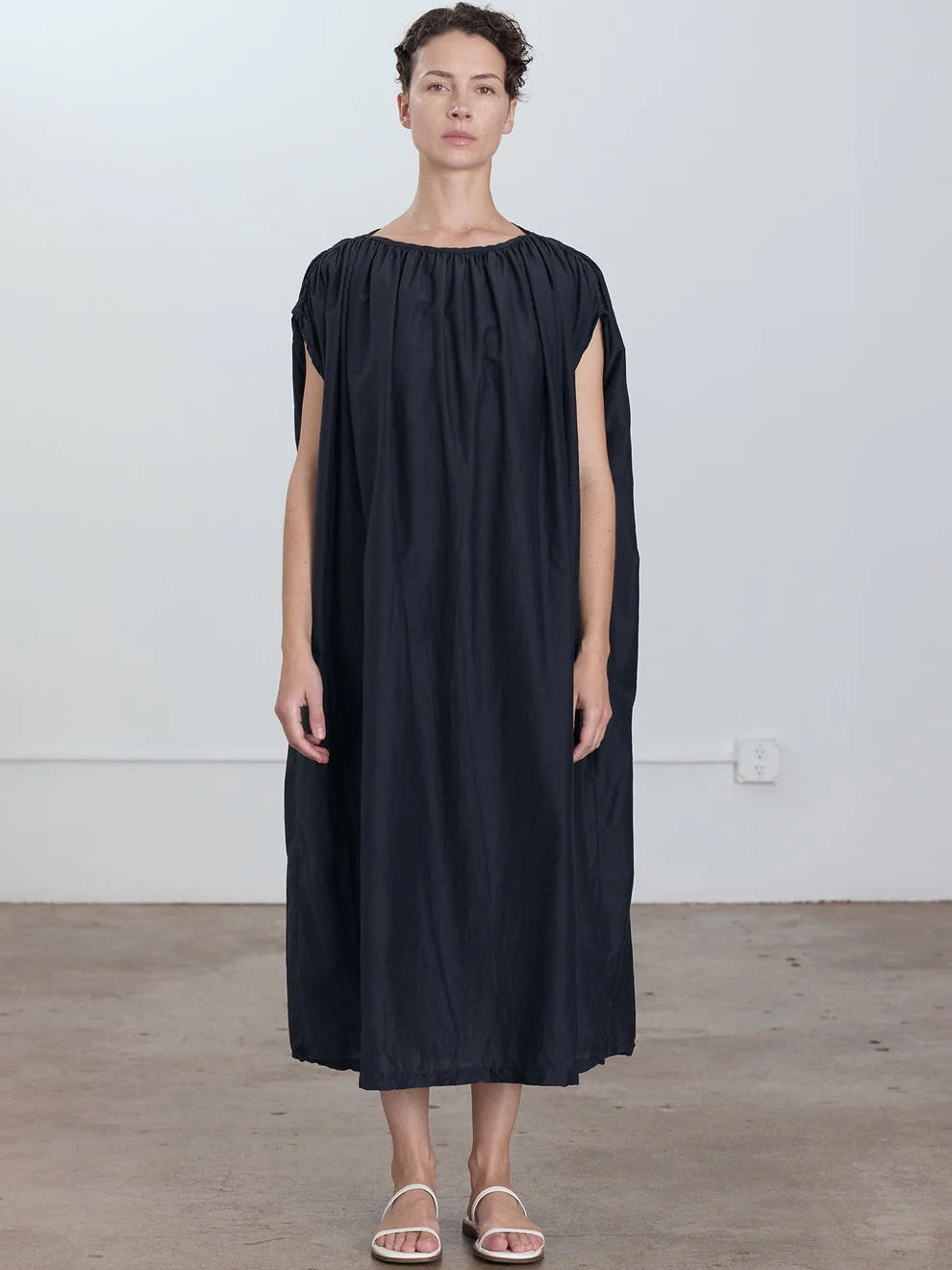 Black Crane Mont Blanc Dress in Faded Black - full length front view on model showing oversized silhouette and shoulder piping with shirring