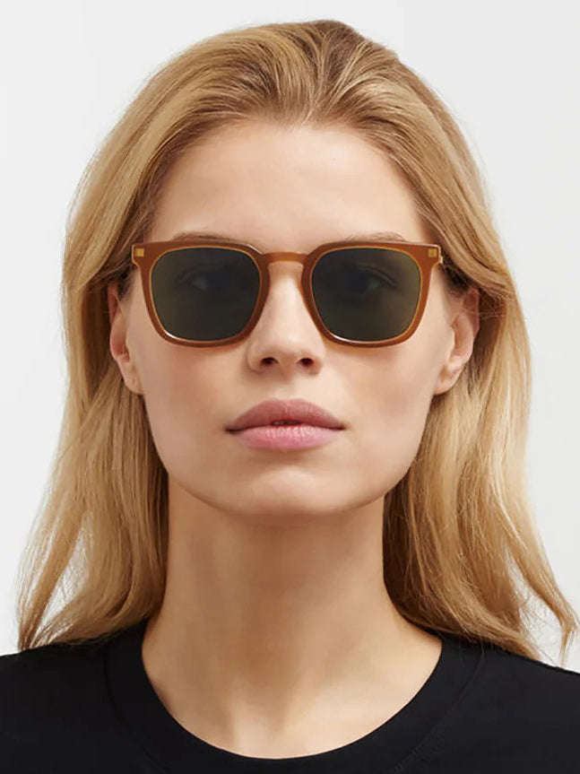 Mykita Borga Sunglasses in Brown Glossy Gold worn on model, front-facing view, warm amber square acetate frame, deep green polarised lenses