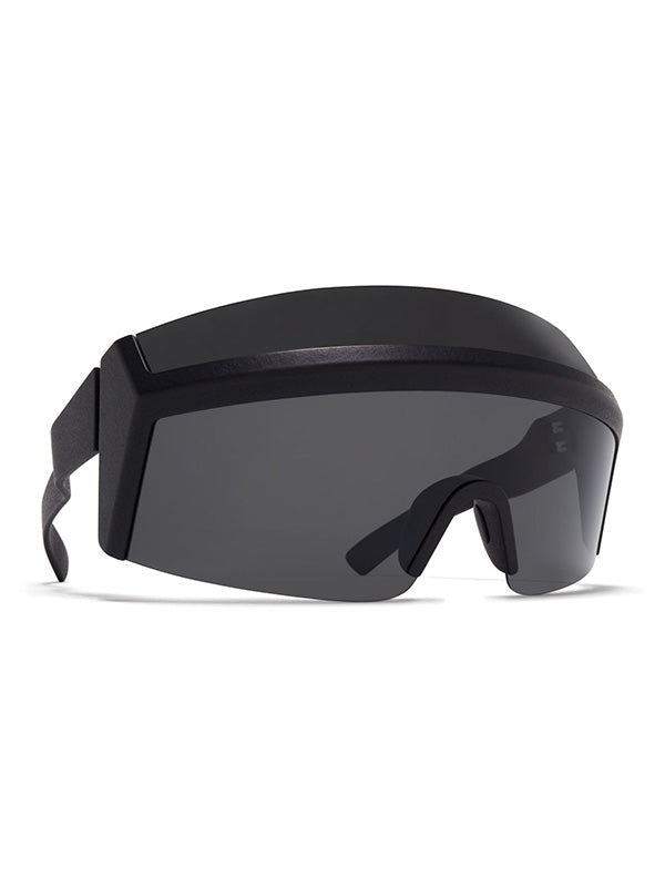 Mykita SATORI Sunglasses black, three-quarter angle revealing the substantial depth of the visor-style frame, wraparound dark grey lens, and textured matte black temple arms