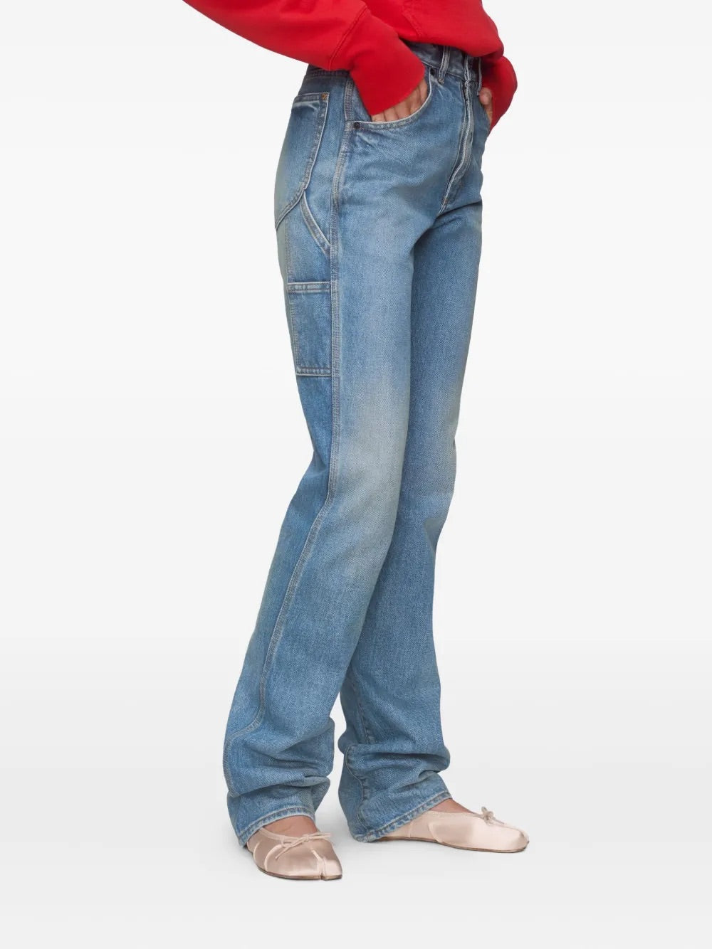 Side close-up of a female model wearing the Maison Margiela Pants 5 Pockets in Light Blue Indigo, emphasizing the straight-leg fit, clean side seam, and tailored drape of the fabric.