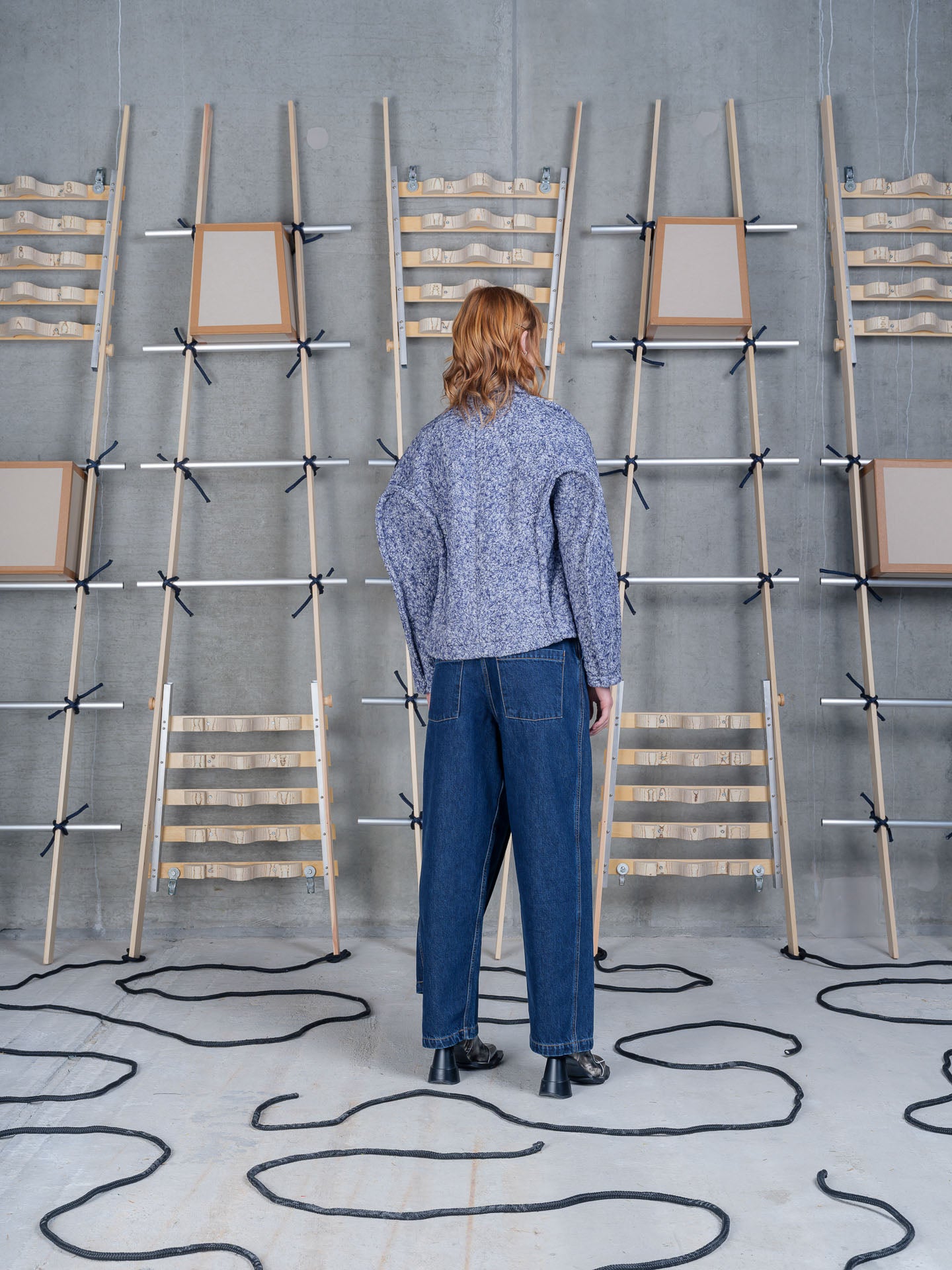 Model wearing Relaxed Dartbi Jacket in Blue Pebbles by Henrik Vibskov back view
