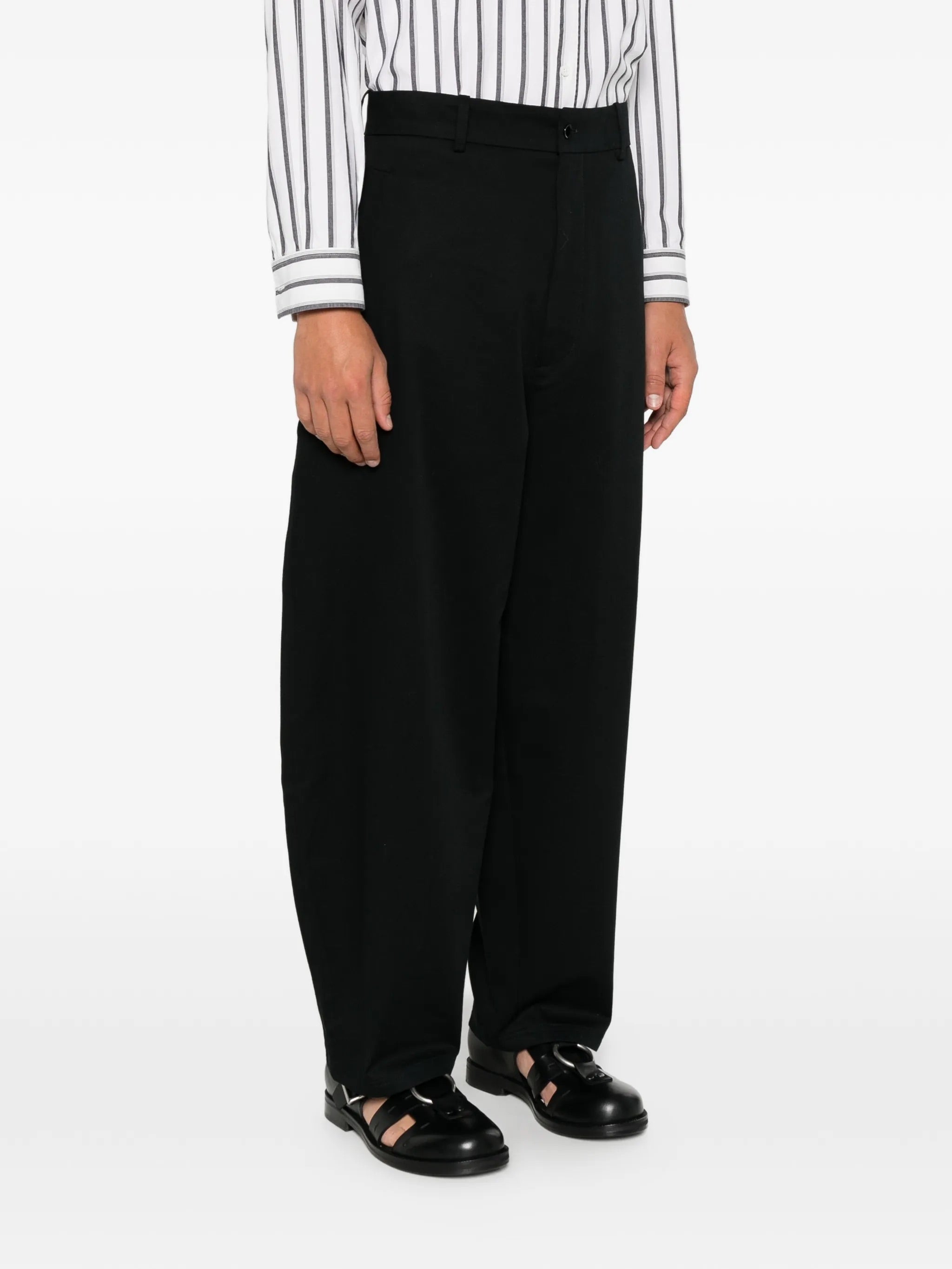 House Of The Very Islands Ryker Pants in Black - front view on model showing button and zip fly closure and wide leg detail