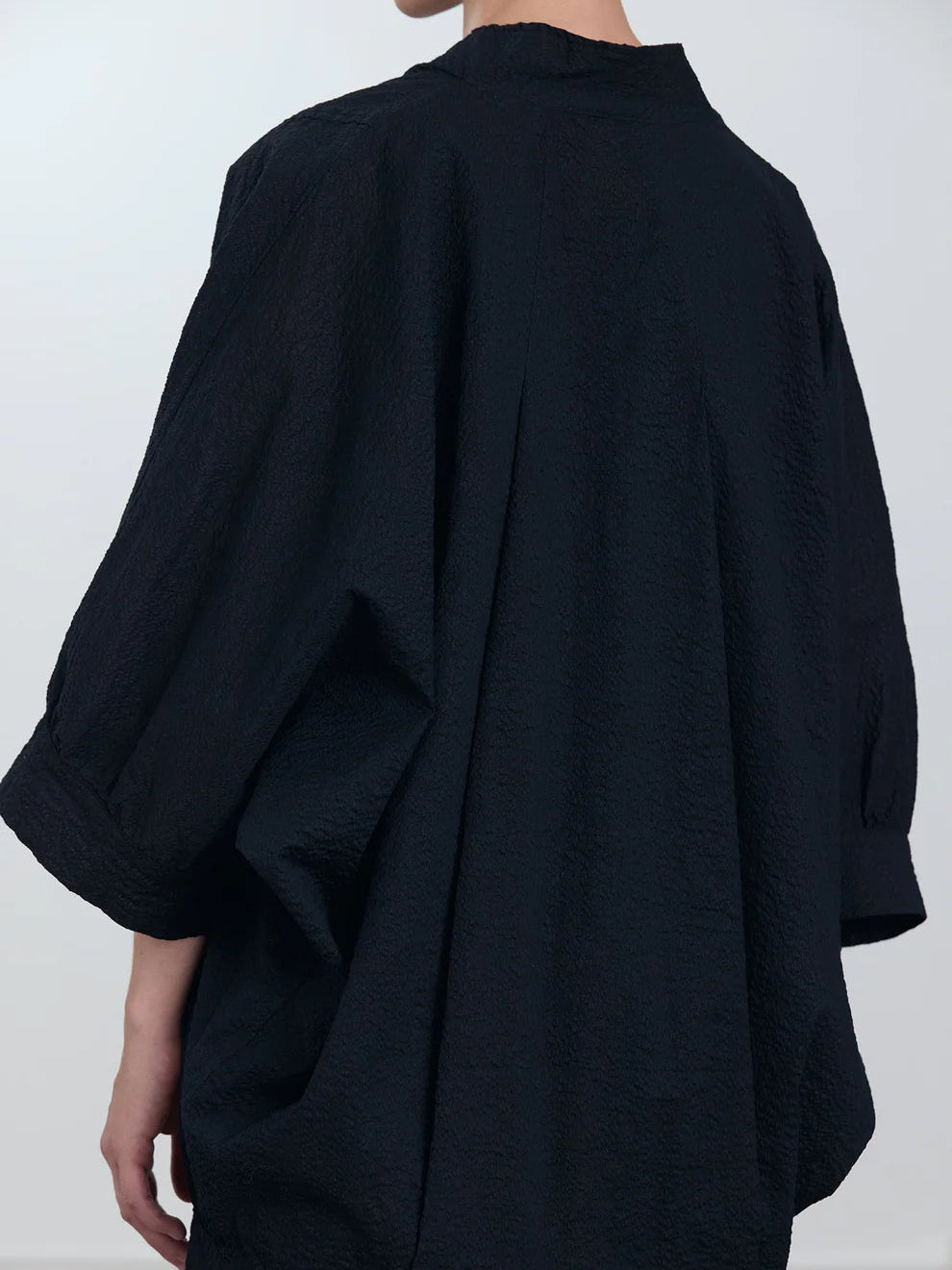 Black Crane Spoon Jacket in Midnight - detail view showing balloon shaped sleeve and ripple textured Japanese cotton fabric