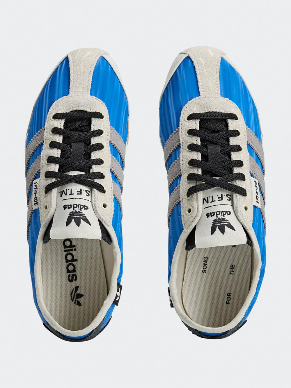 Adidas Tokyo W SFTM in Blue/Solid Grey/Off White - top view showing blue upper with grey three stripes and lace-up closure