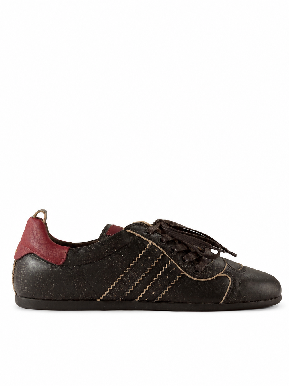 Vivienne Westwood Drunken Trainer in Off Black distressed leather with burgundy heel panel, serrated side stripes and off-centre laces