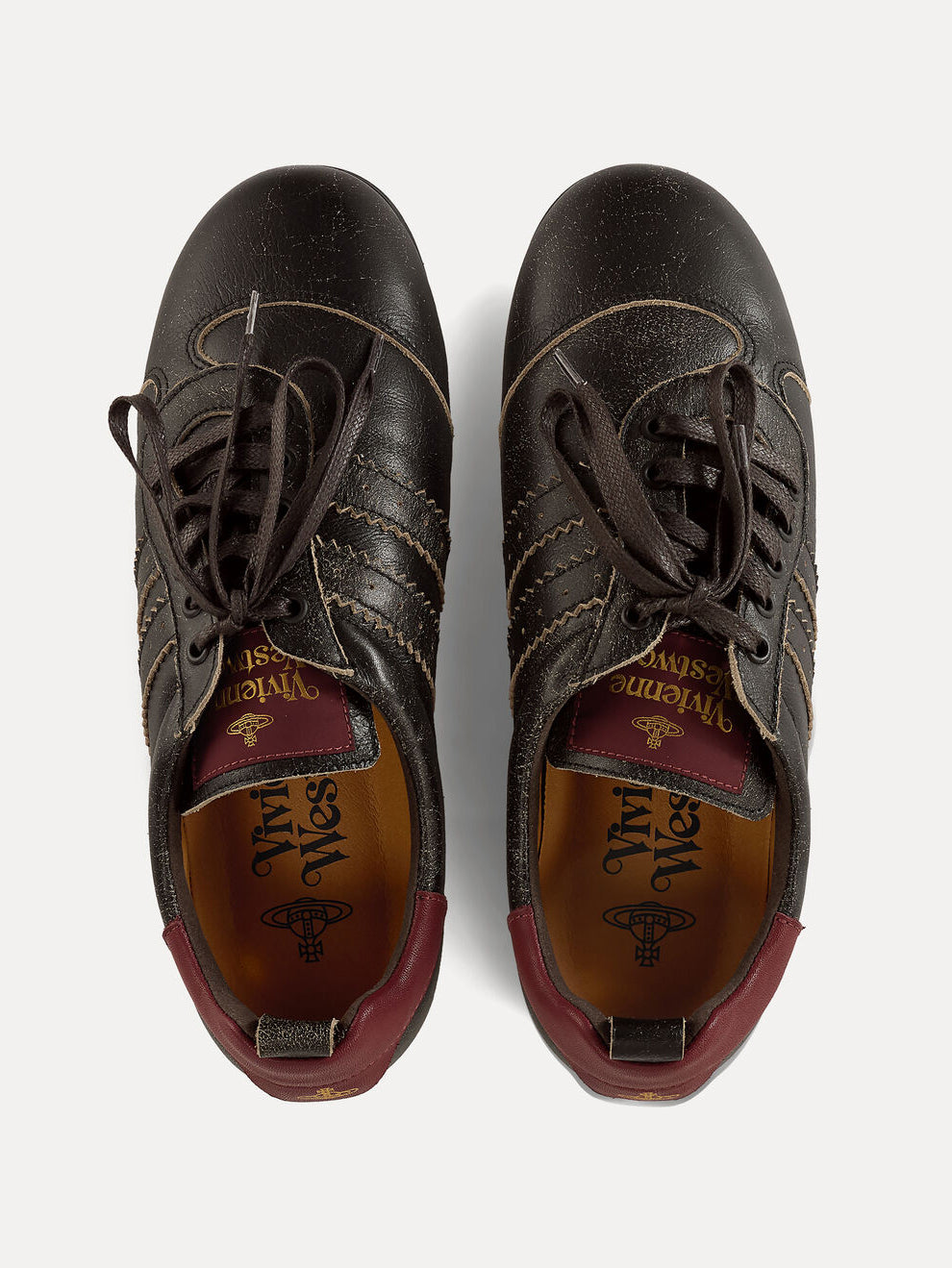 Top view of Vivienne Westwood Drunken Trainers in Off Black with asymmetric uppers, off-centre laces and burgundy lining