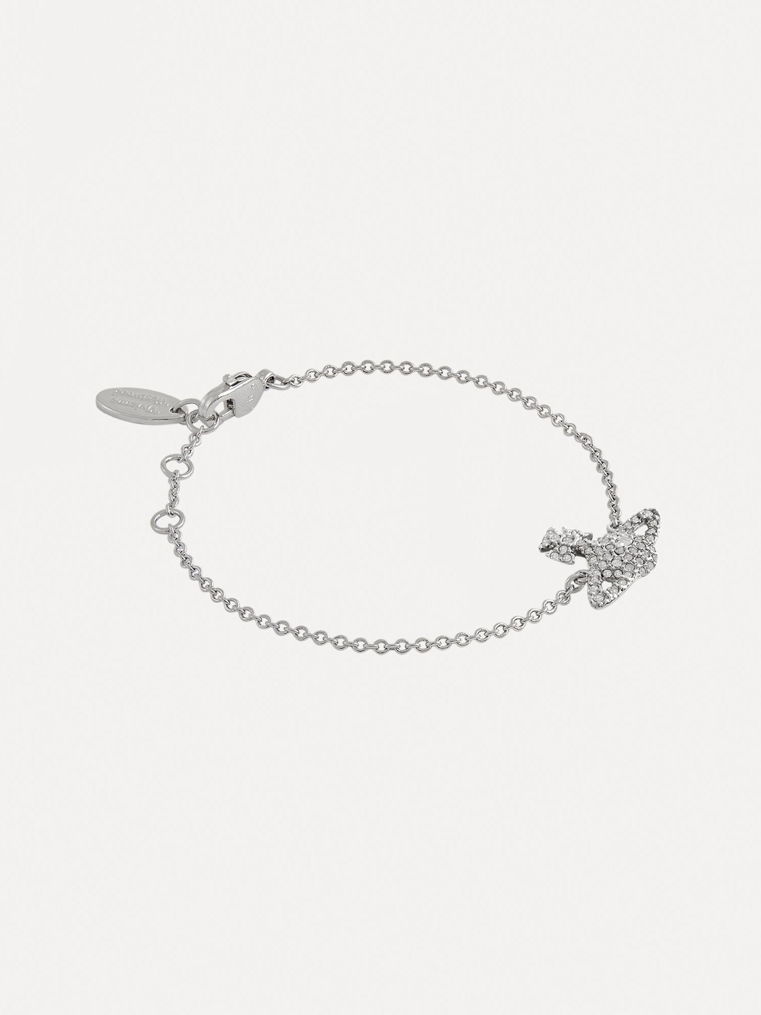 Vivienne Westwood Grace Bas Relief Bracelet in platinum crystal showing delicate chain, logo tag, adjustable clasp and crystal orb motif