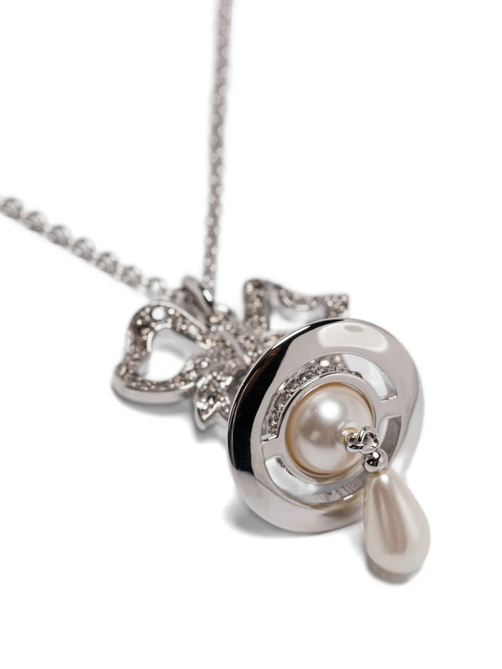 Rigoberta Pearl Pendant by Vivienne Westwood, closeup of crystal-pave bow pendant with signature Orb motif, lustrous cream pearl setting and delicate teardrop pearl drop, silver-tone finish, Spring/Summer 2026