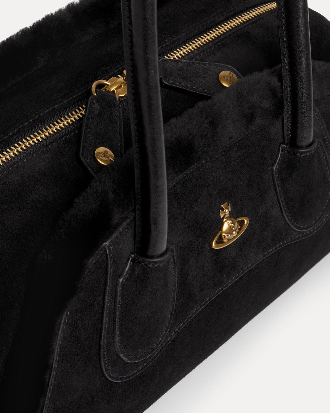 Vivienne Westwood Small Holdall in Black, close-up detail of the top handles, zip fastening, gold-tone hardware and front orb plaque.