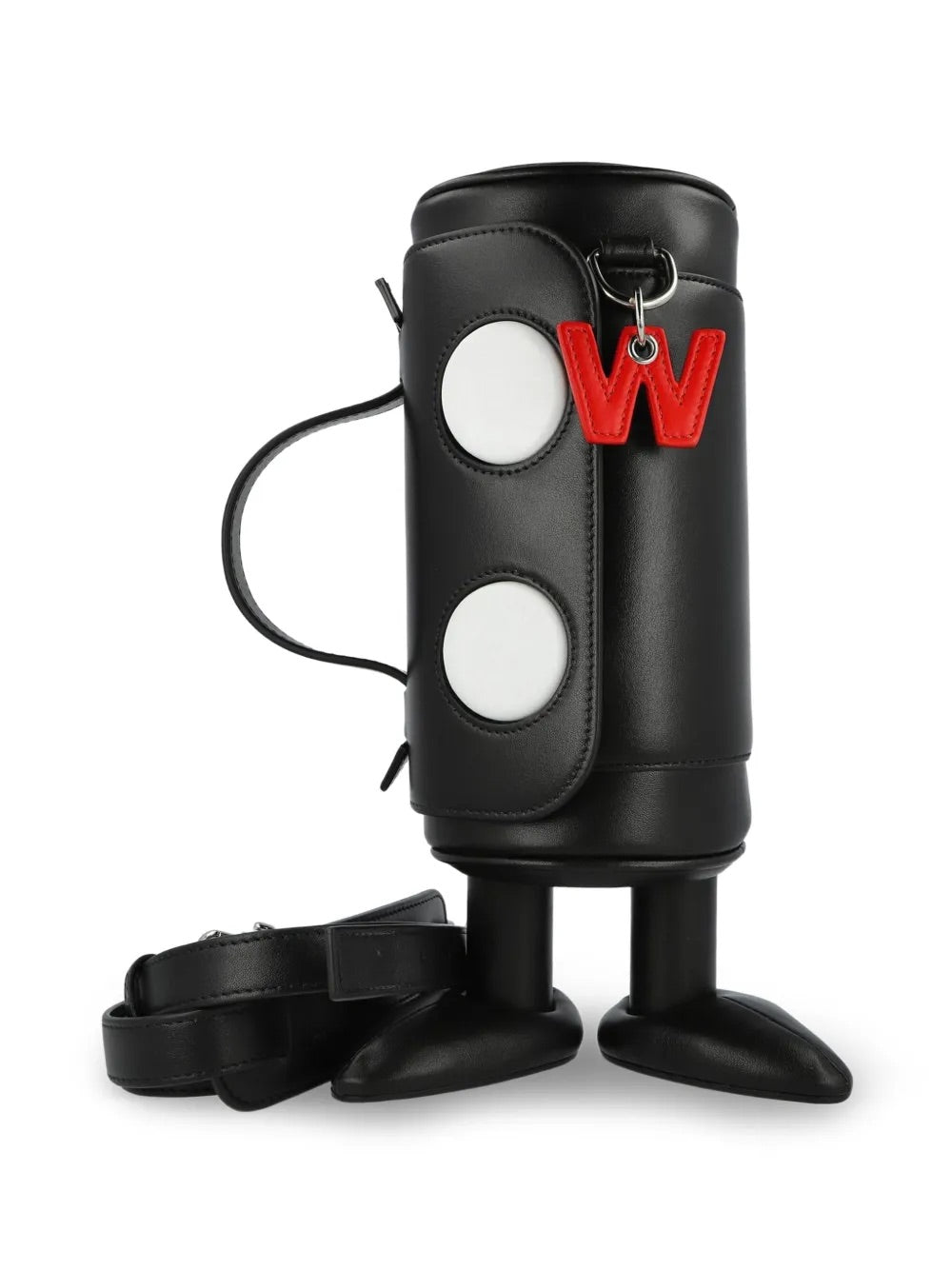 My Cilinder Friend Bag in Comb. I Black by Walter Van Beirendonck, back view of black leather cylindrical bag on sculptural footed base with detachable shoulder strap and red logo charm detail
